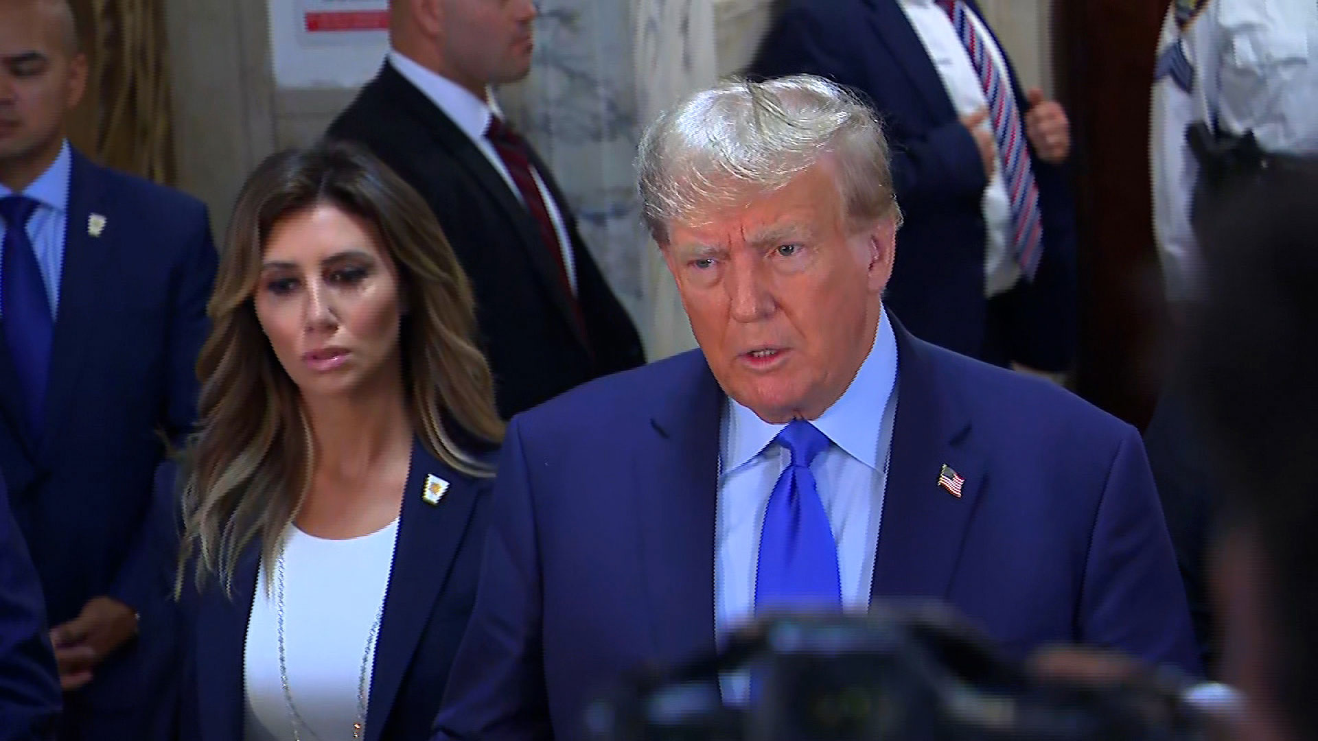 Former President Donald Trump speaks to the press inside the courthouse ahead of his civil fraud trial on Monday in New York.