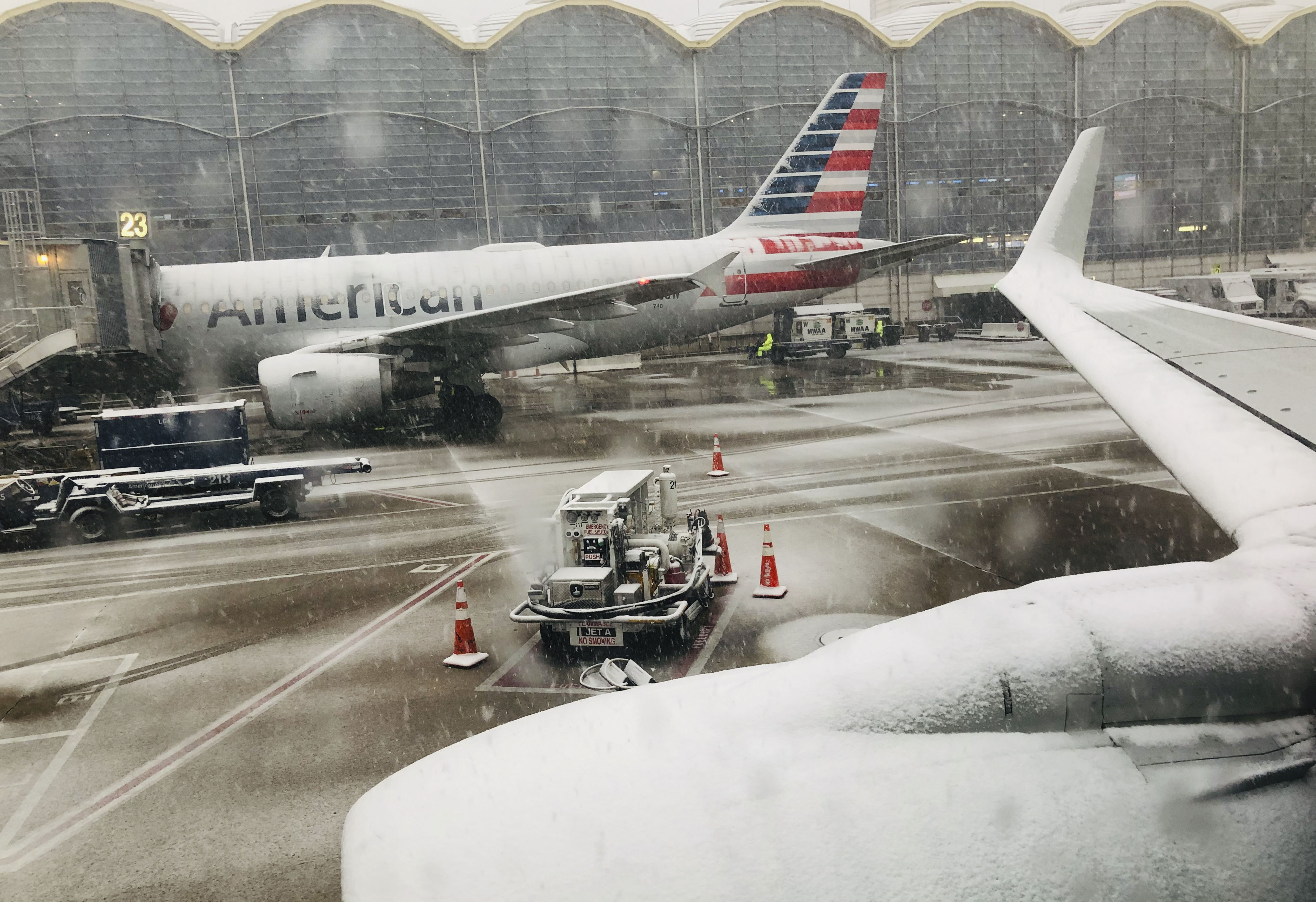 Snow falls at Ronald Reagan Washington National Airport in Washington, DC.