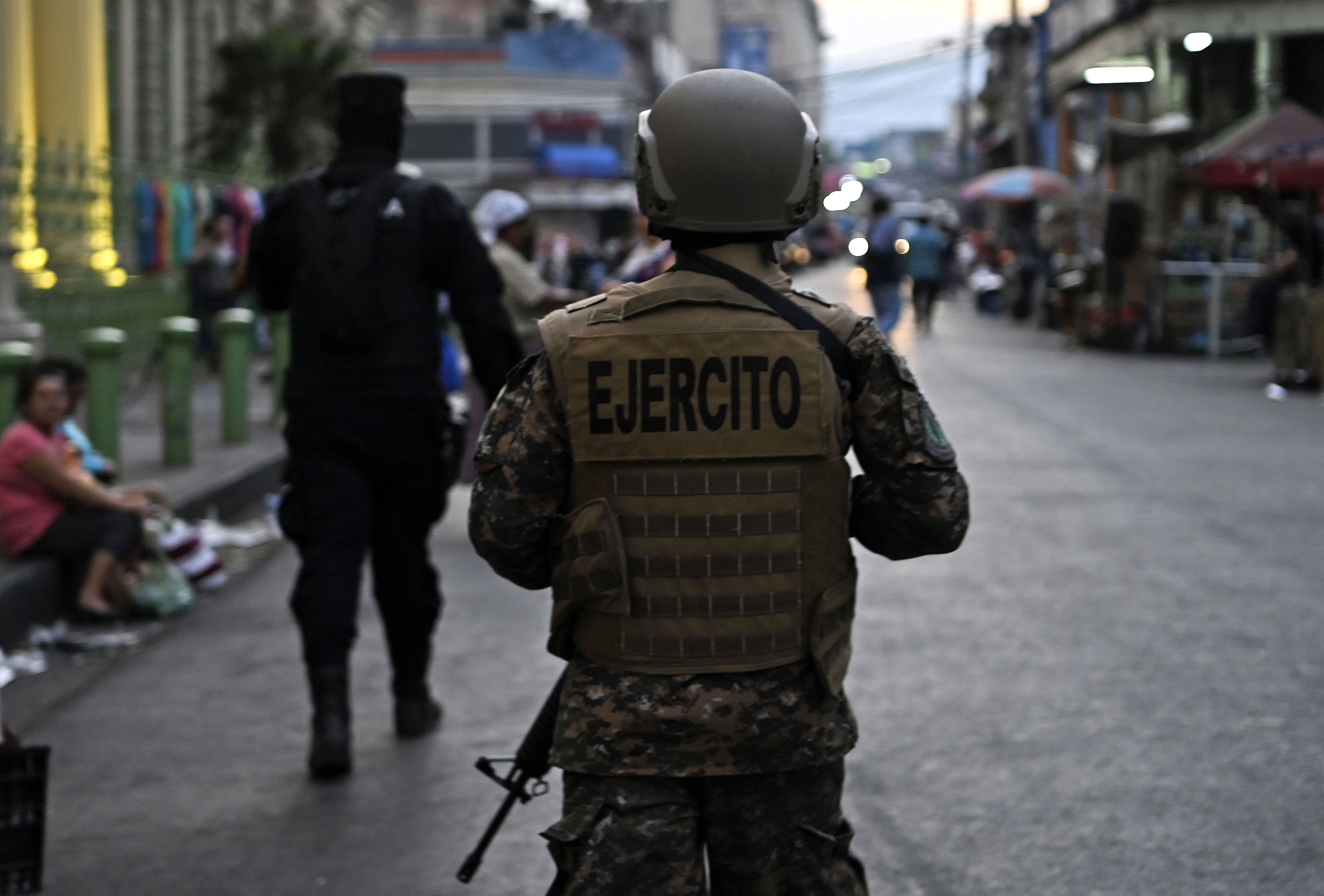 A member of the El Salvador military clears people from the historic center of San Salvador as part of the government's emergency decree to curb the spread of coronavirus, on March 21.