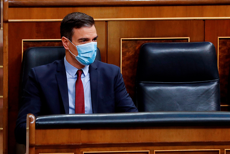 Spanish Prime Minister, Pedro Sanchez wears a face mask during a parliamentary plenary session on May 20. 
