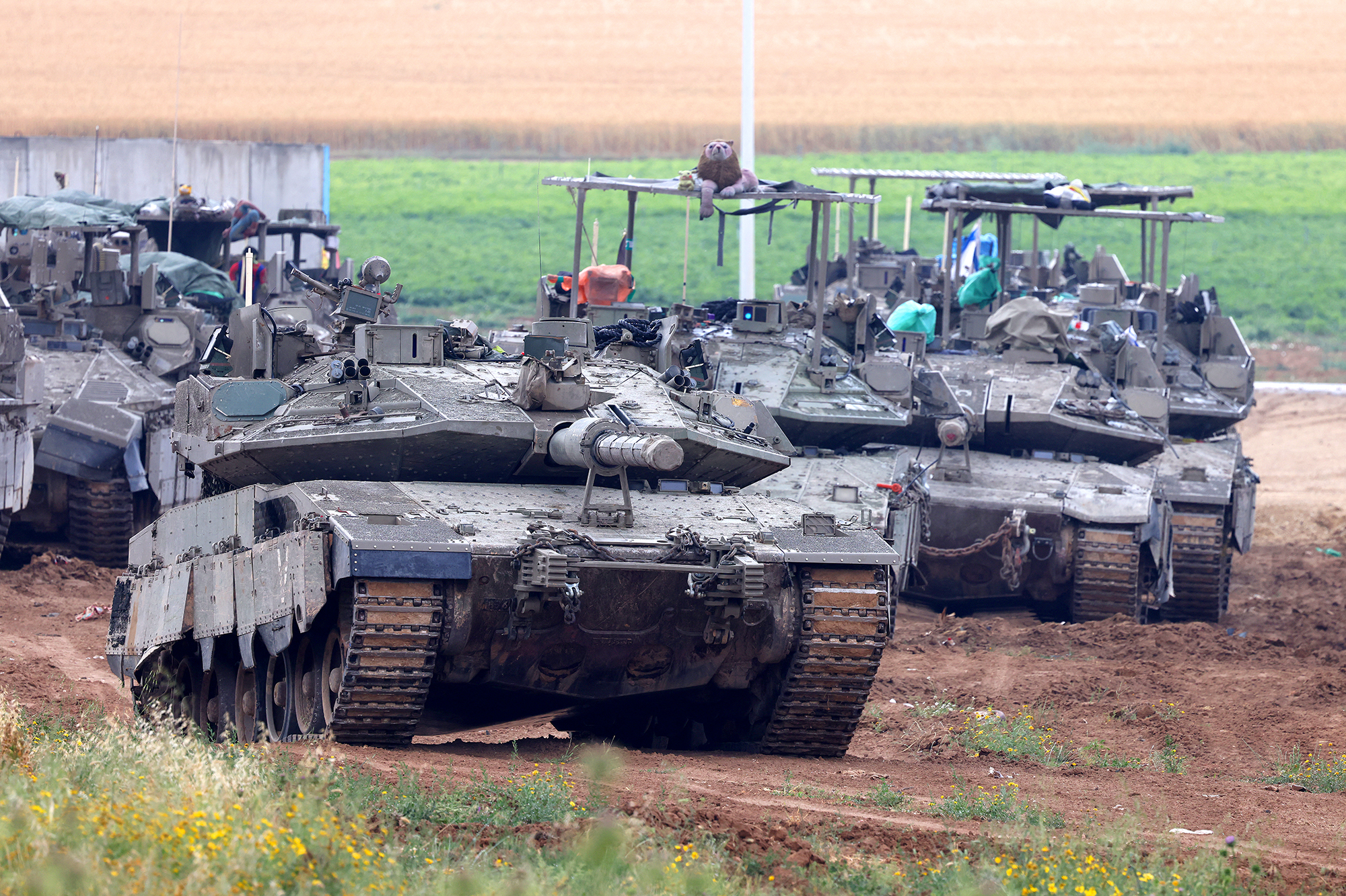 Israeli army tanks move in an area along the border with the Gaza in southern Israel on April 10.