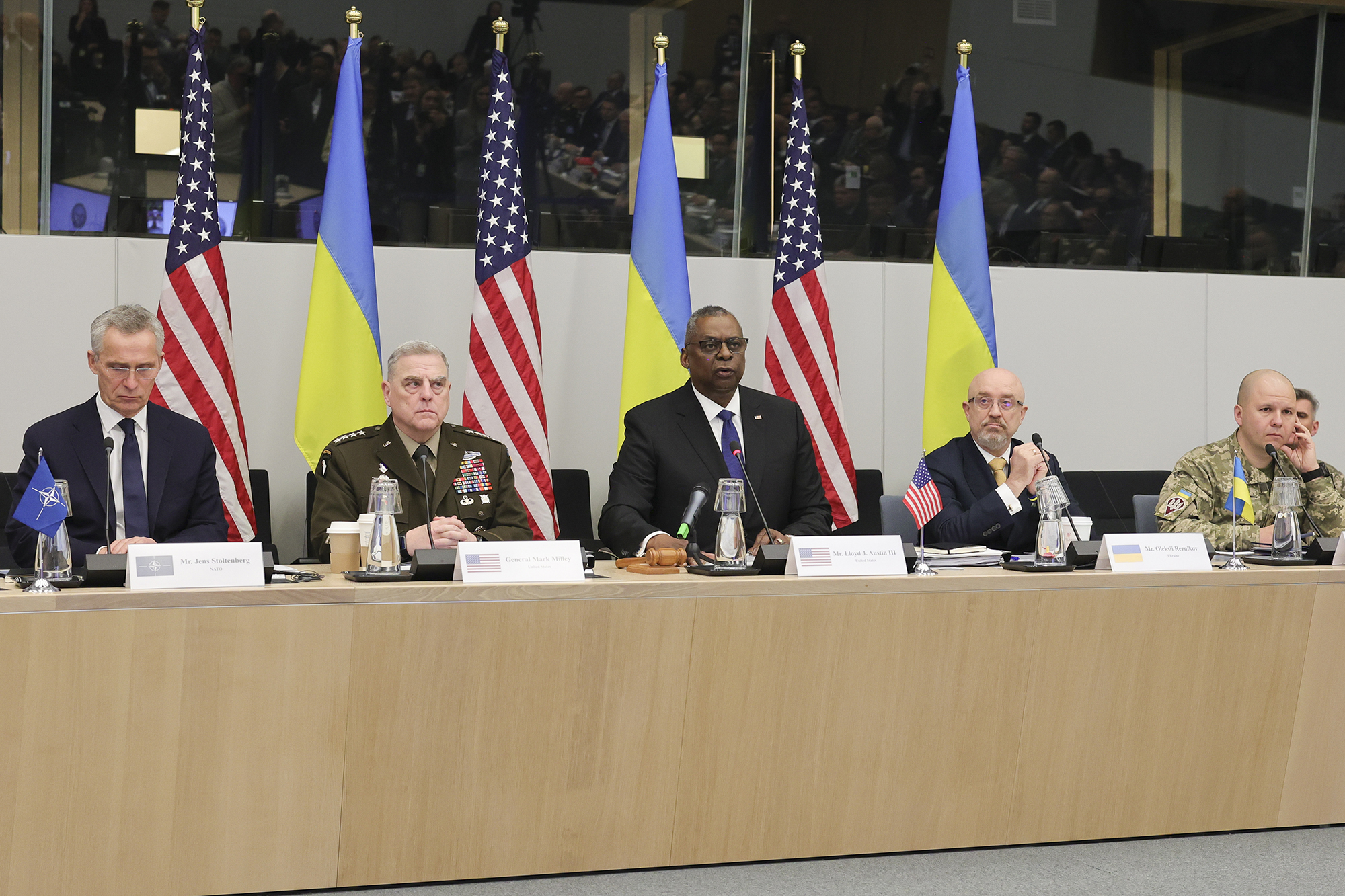 NATO Secretary General Jens Stoltenberg, left, Joint Chiefs of Staff Mark Milley, second left, United States Secretary of Defense Lloyd Austin, center Ukraine's Defense Minister Oleksii Reznikov, second right and Ukraine's Lieutenant General Yevhen Moisiuk, right, are seen during the North Atlantic Council round table meeting of NATO defense ministers at NATO headquarters in Brussels, Belgium, on February 14.