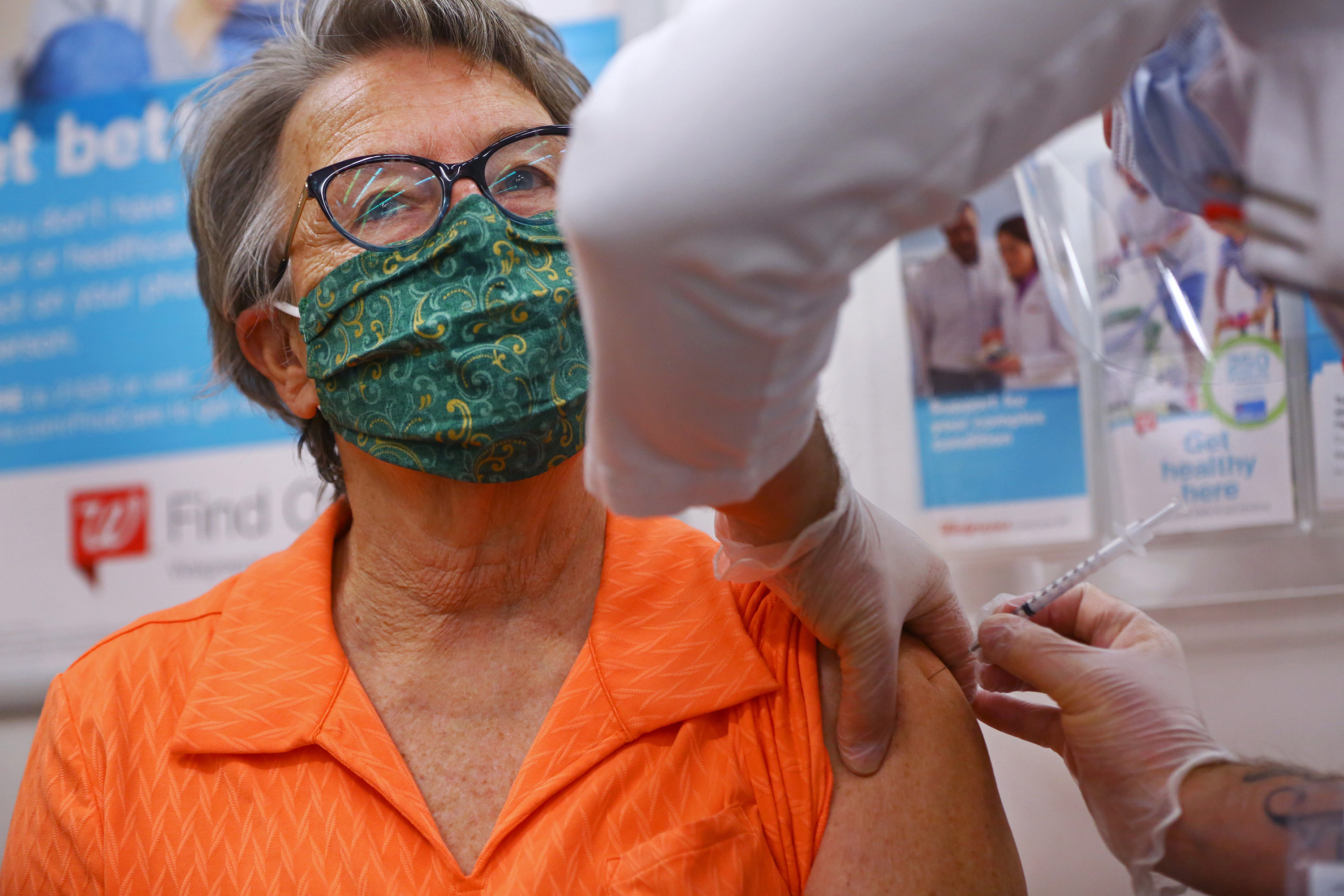 A pharmacist administers a Covid-19 vaccine at a Walmart pharmacy in Danvers, Massachusetts on February 1.