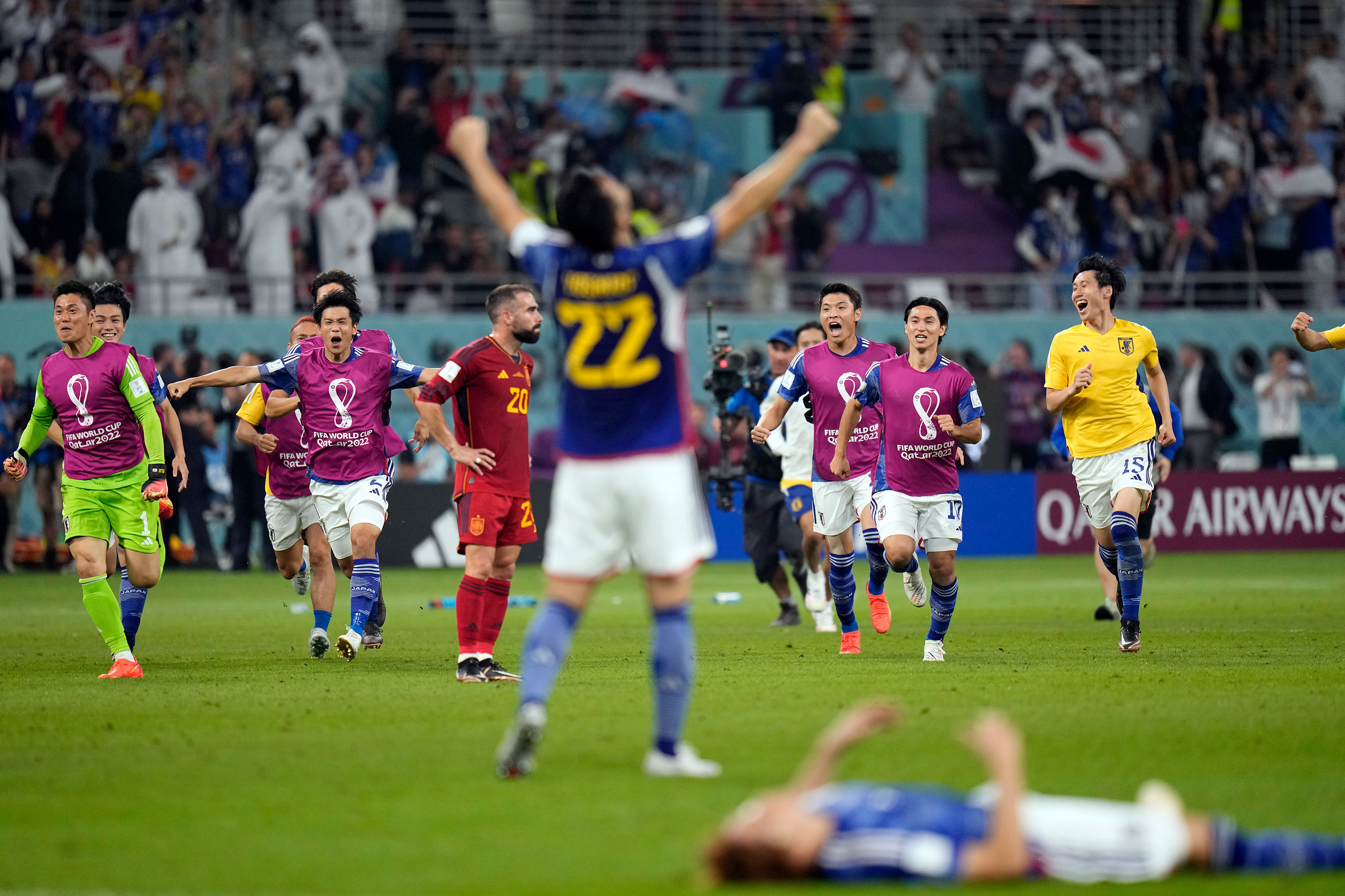 Japanese players celebrate after beating Spain on Thursday.