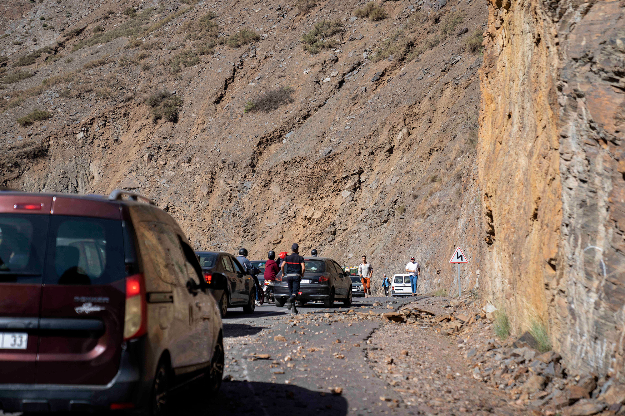 Motorists drive along a road on the way to earthquake-affected villages in the Atlas Mountains, near Marrakech, Morocco, on September 9. 
