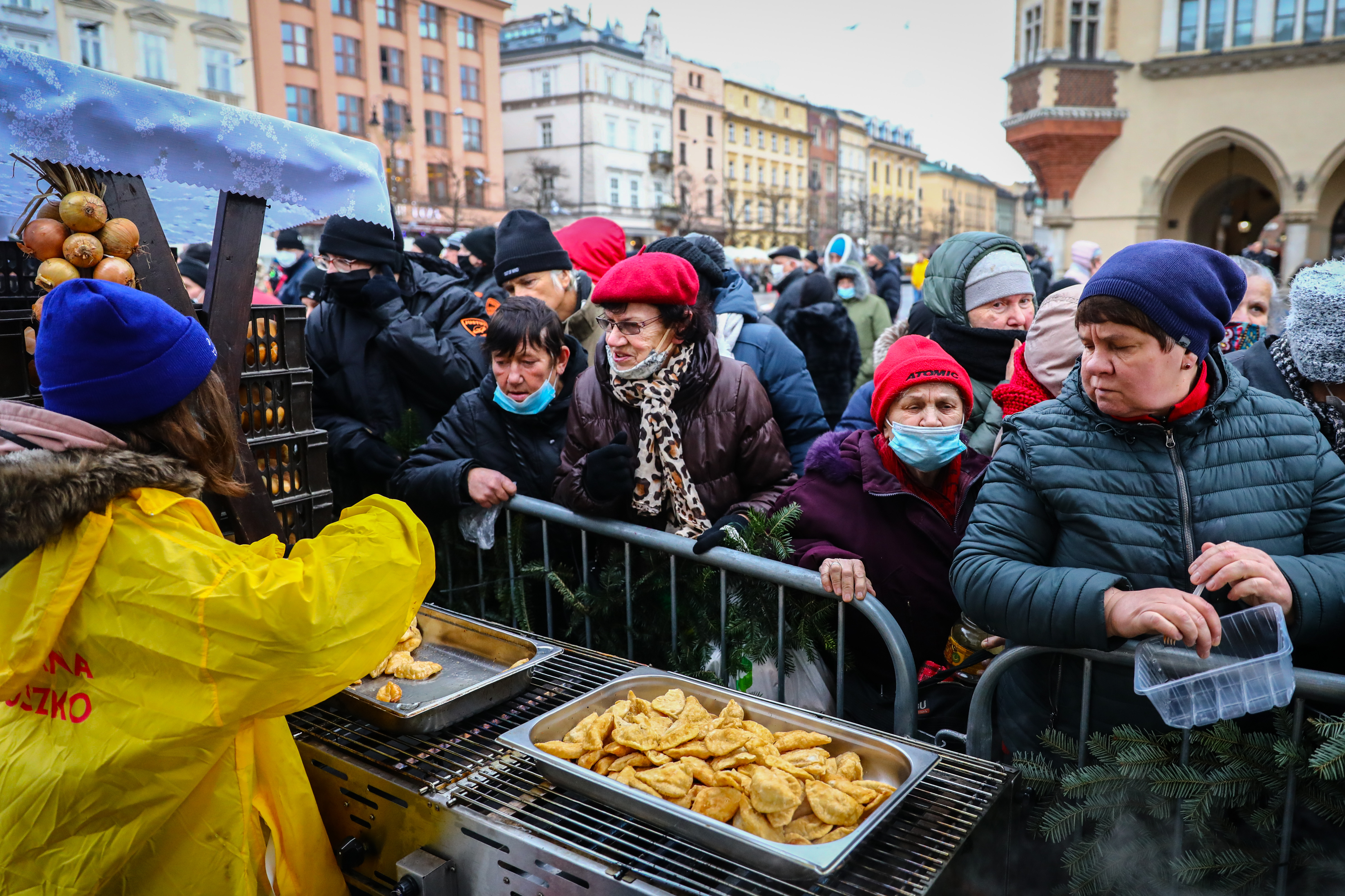 Food distribution during the Christmas Eve Supper for the homeless and poor during the coronavirus pandemic at the Main Square in Krakow, Poland on December 19. 