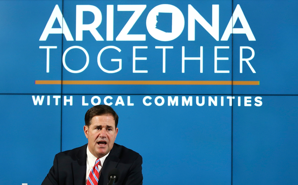 In this Thursday, May 28 photo, Arizona Republican Gov. Doug Ducey speaks about about coronavirus data at a news conference in Phoenix.