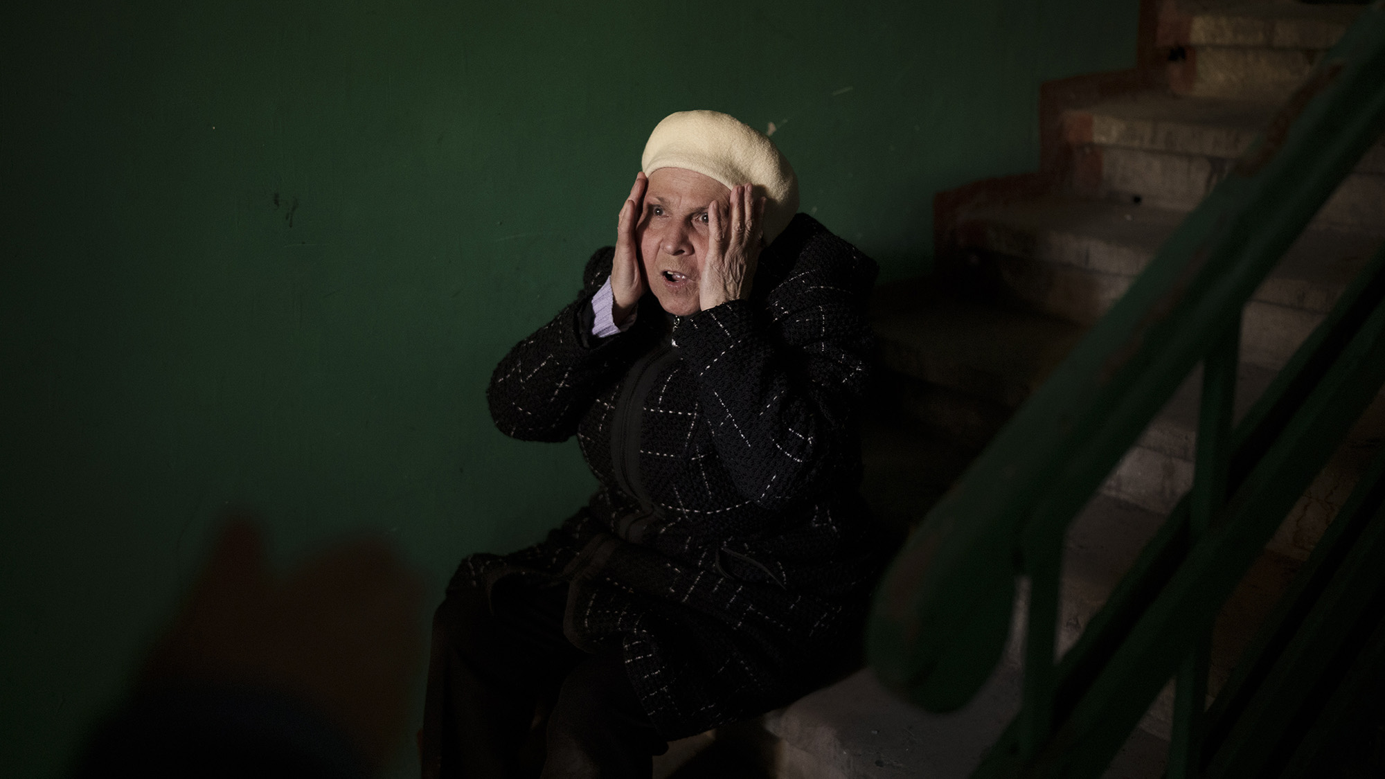 A woman reacts to the death of a 15-year-old boy killed during a Russian attack in Kharkiv, Ukraine on Friday April 15.