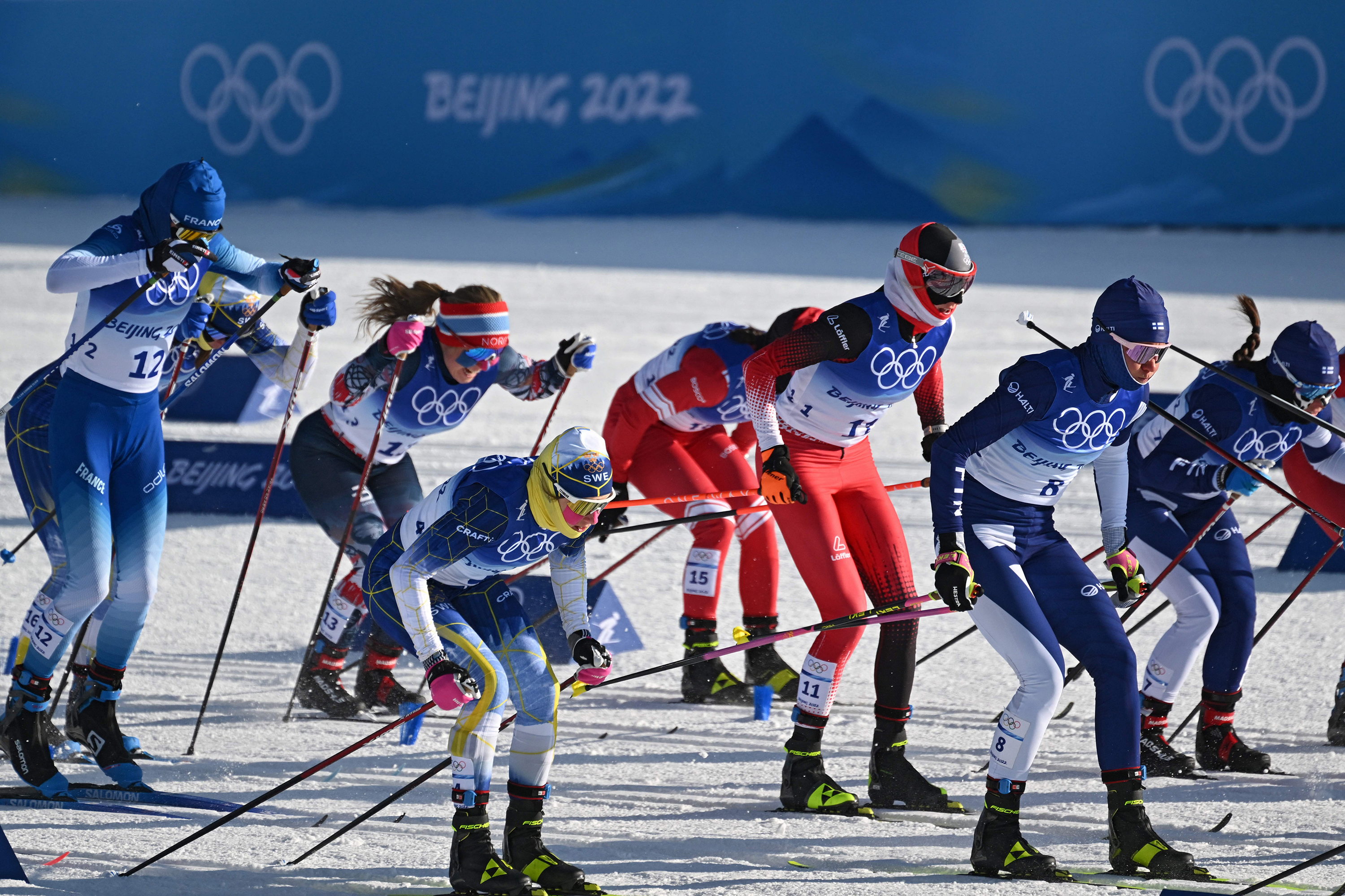 Athletes compete at the start of the women's skiathlon 2x7.5km event on February 5 at the Zhangjiakou National Cross-Country Skiing Centre. 