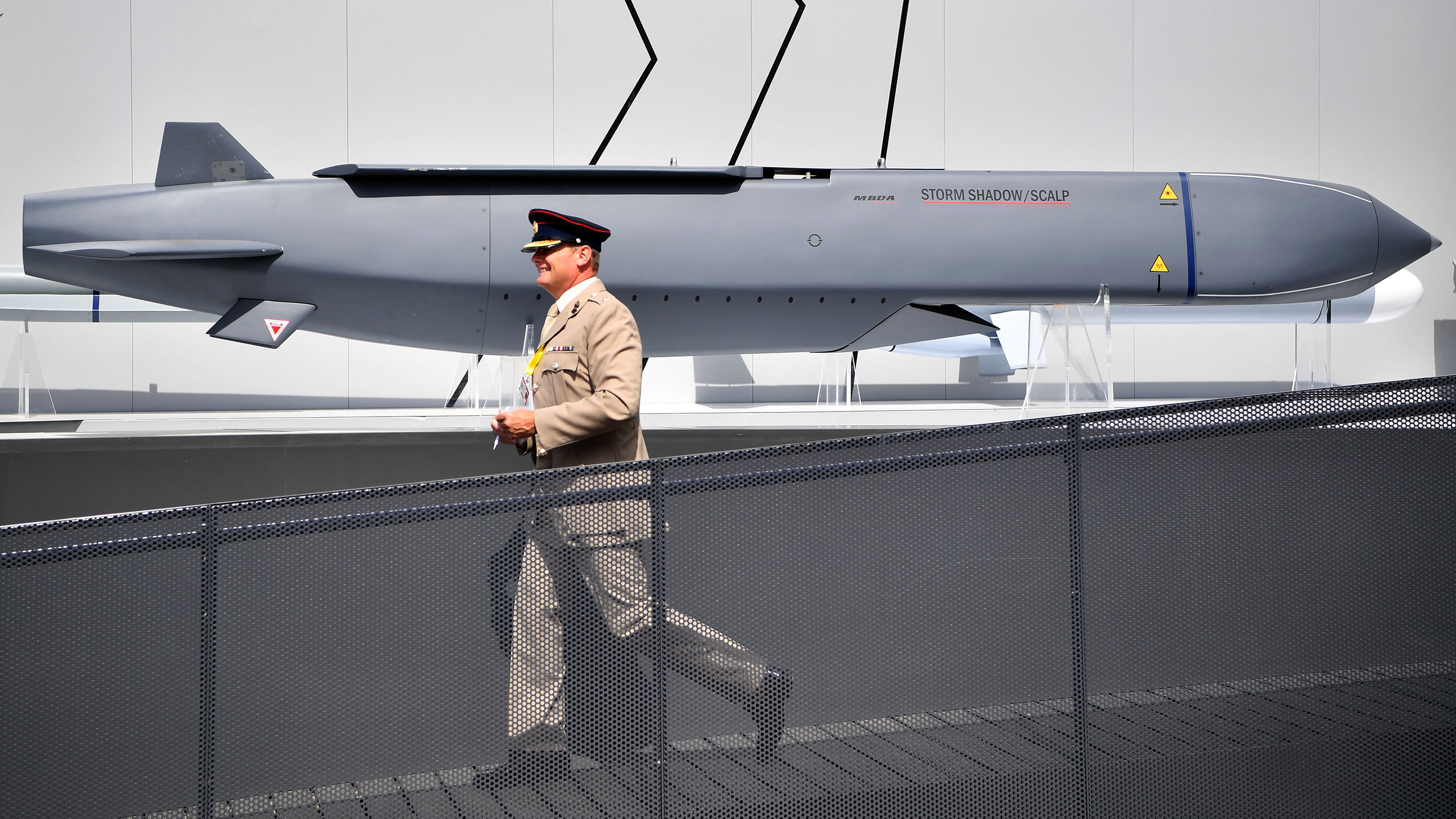 In this 2018 photo, a member of the military walks past a MBDA Storm Shadow/Scalp missile at the Farnborough Airshow southwest of London.