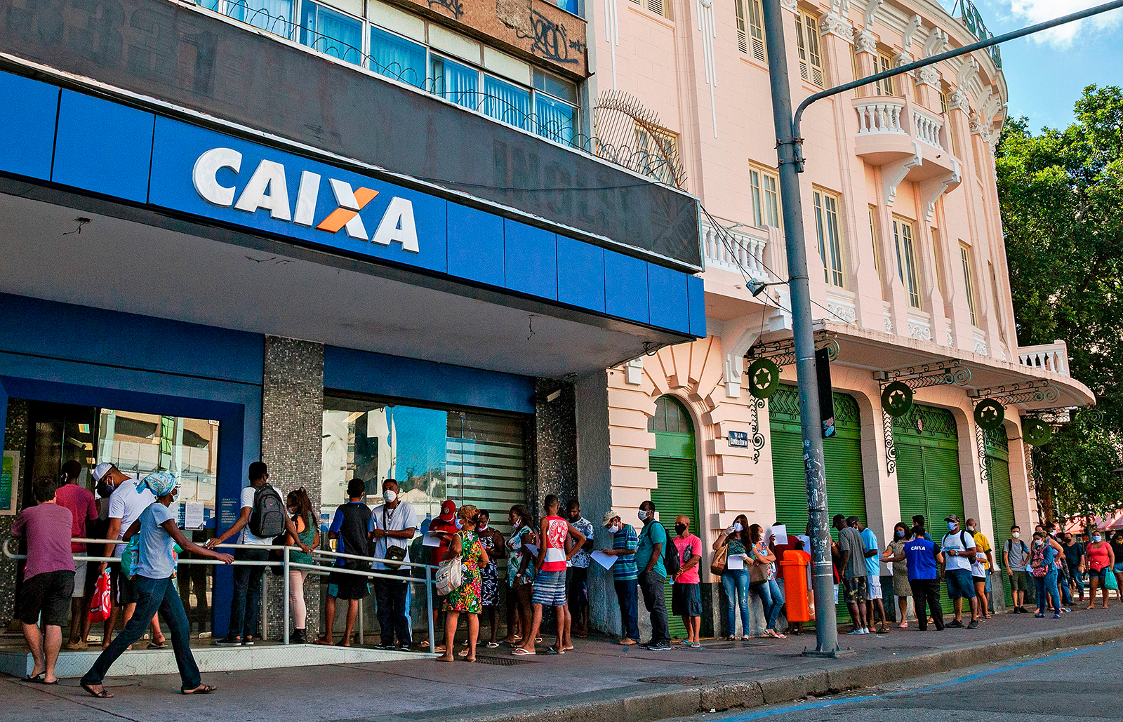 People queue in Rio de Janeiro to claim their government allowance on April 27.