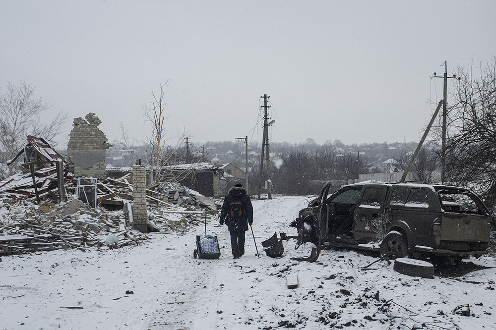 A man walks through the rubble of a building destroyed by shelling in Bakhmut, Ukraine, on January 29.