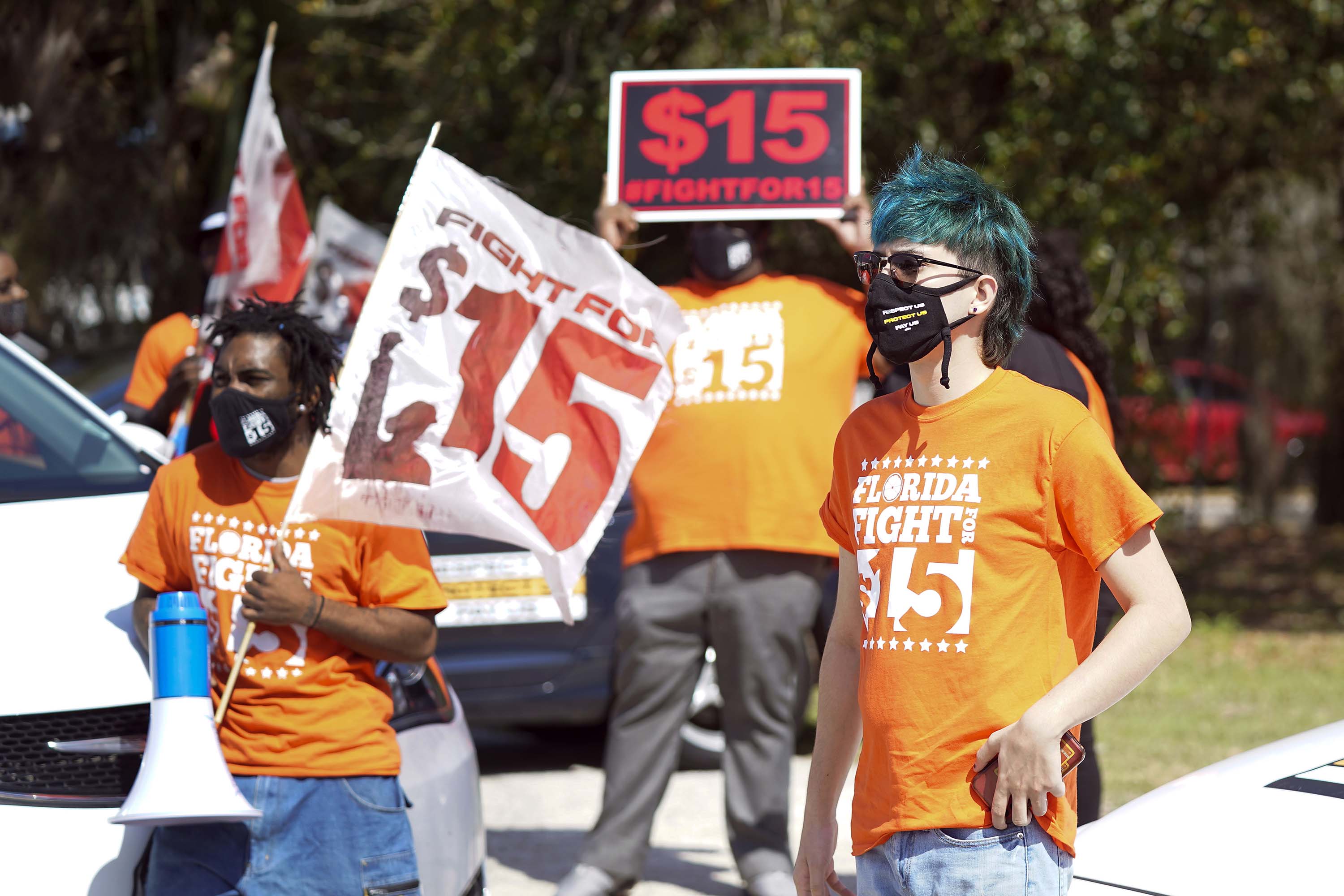 People attend a rally for a $15 an hour minimum wage on February 16, in Orlando, Florida. 