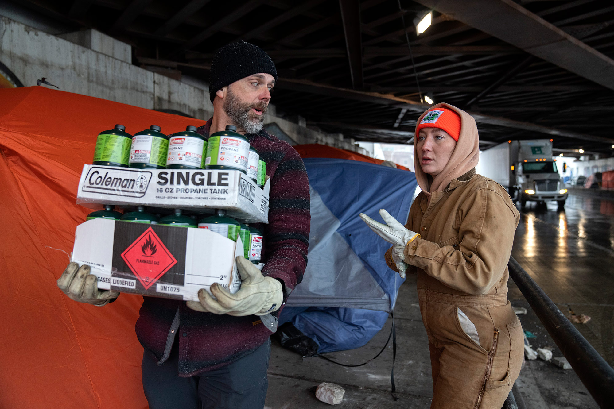 Volunteers deliver propane for portable heaters to homeless people in Chicago, on December 22. 