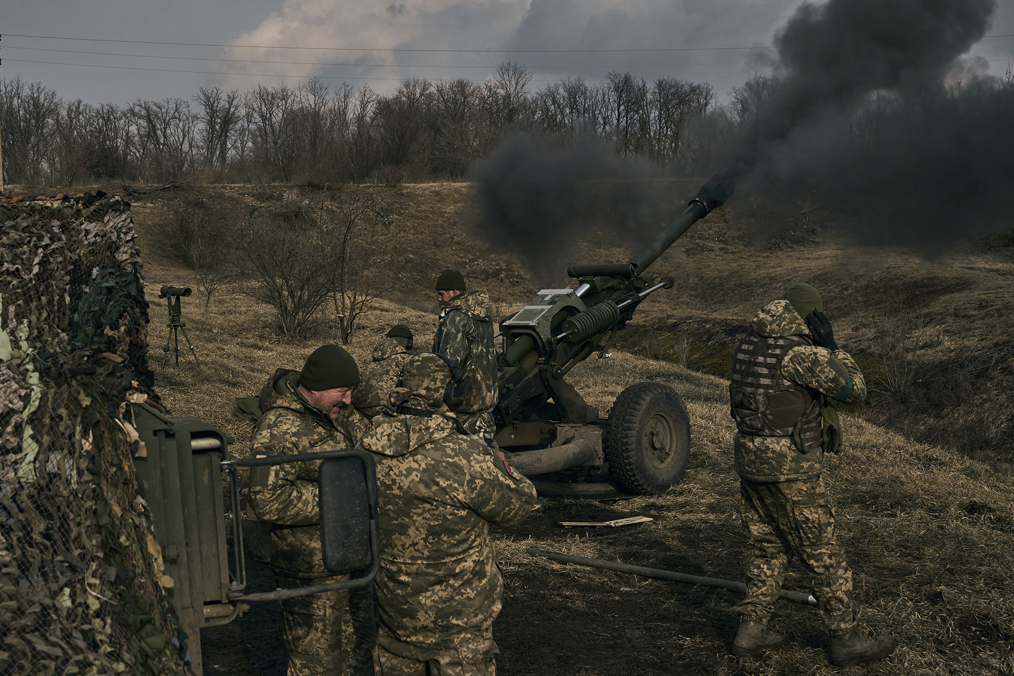 Ukrainian soldiers fire a self-propelled howitzer towards Russian positions near Bakhmut, Ukraine, on March 7.