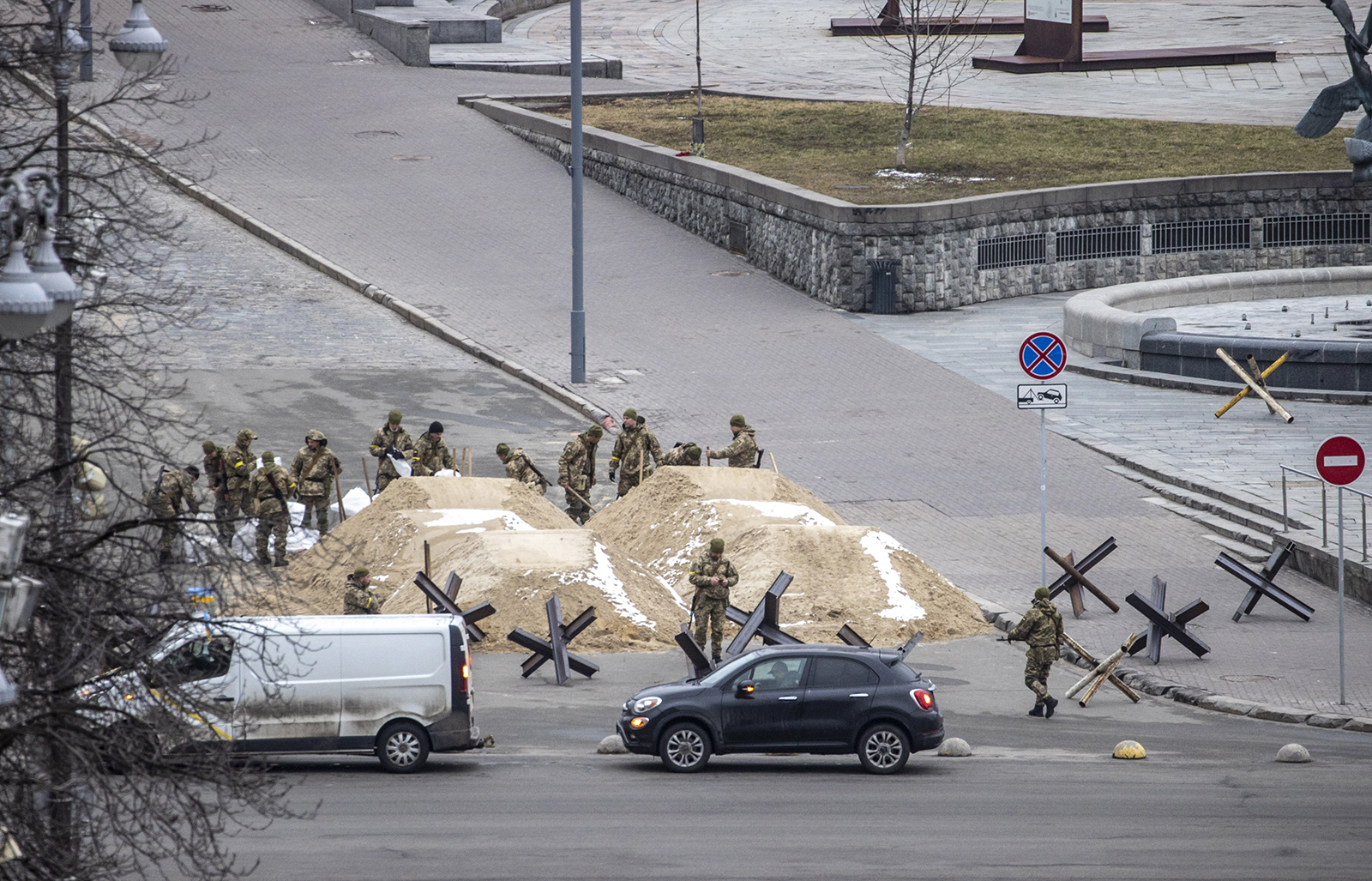 Soldiers use sand to block a road in Ukrainian capital of Kyiv on March 1. 