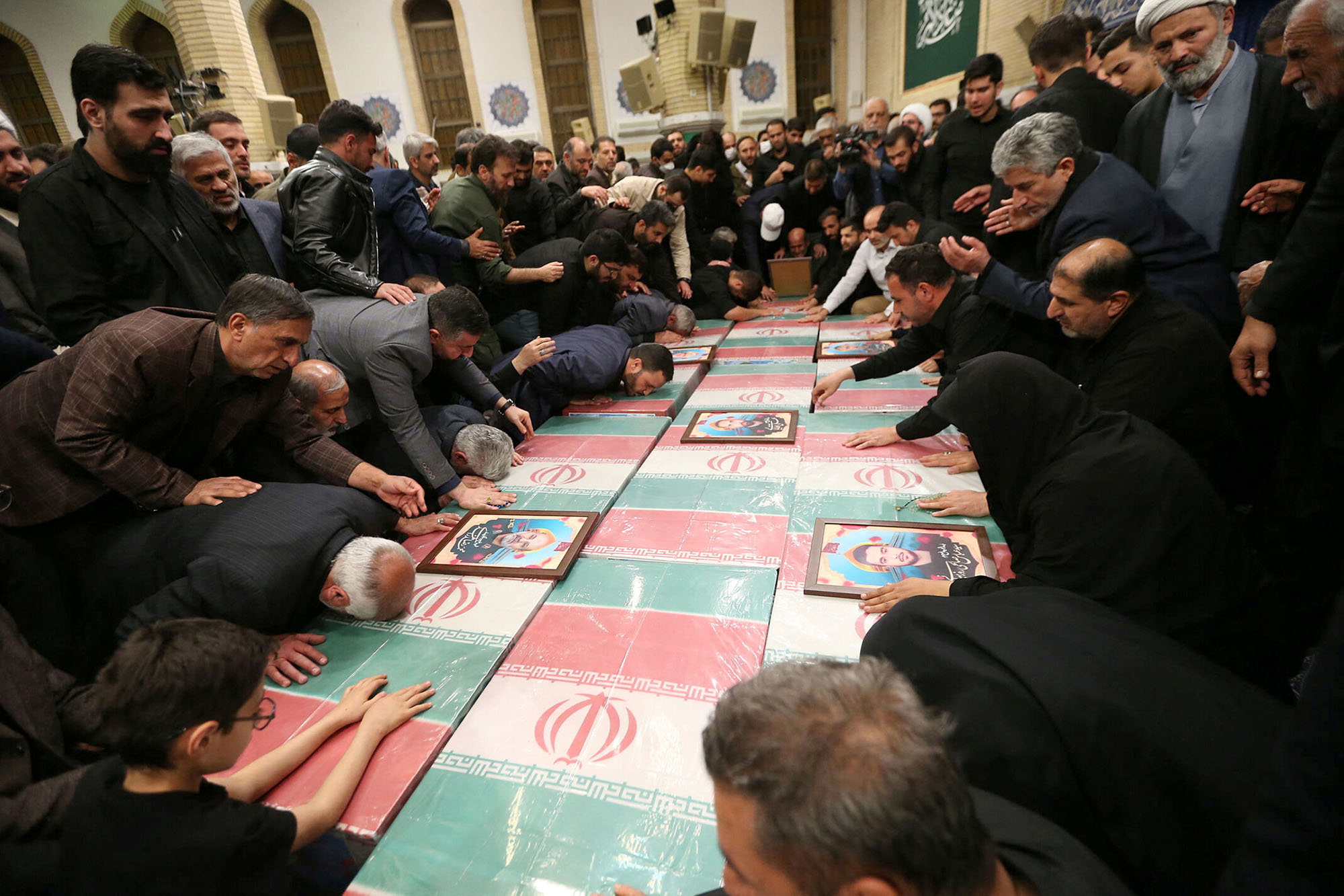 Families of members of the Islamic Revolutionary Guard Corps who were killed in the Israeli airstrike on the Iranian embassy complex in the Syrian capital Damascus, attend a funeral ceremony in Tehran, Iran, on April 4. 