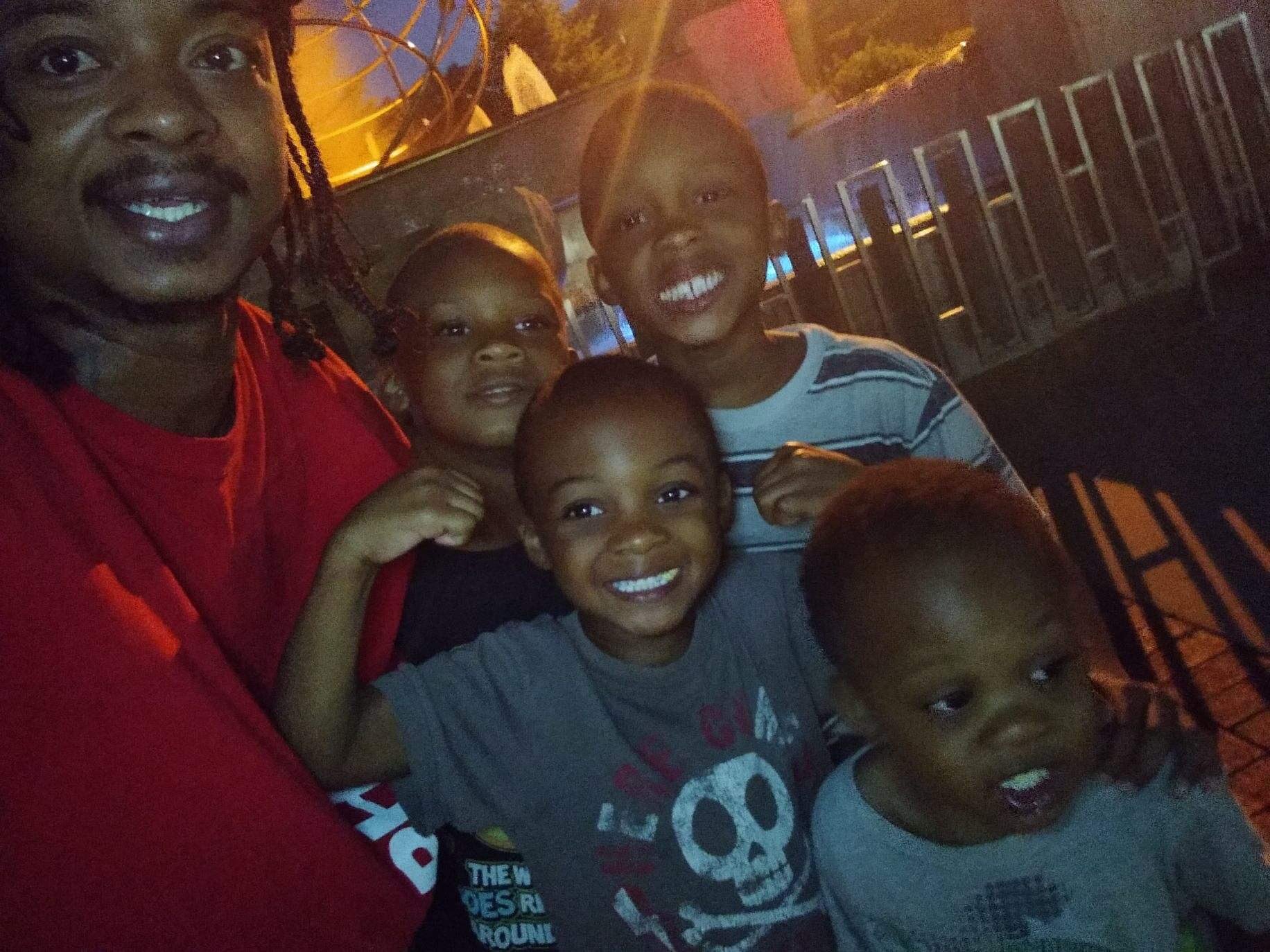 Jacob Blake, left, is pictured with his four sons.