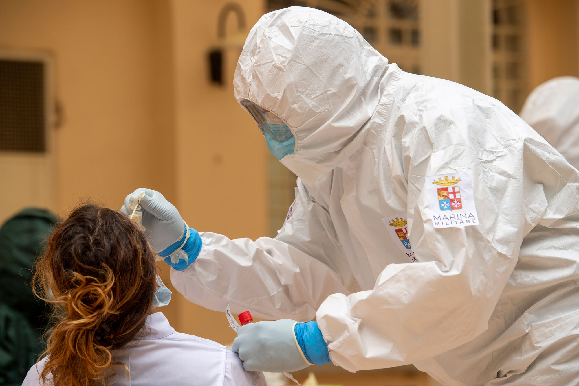 An Italian Navy doctor administers a Covid-19 test inside a health facility on May 21 in Tempio Pausania, Italy. 