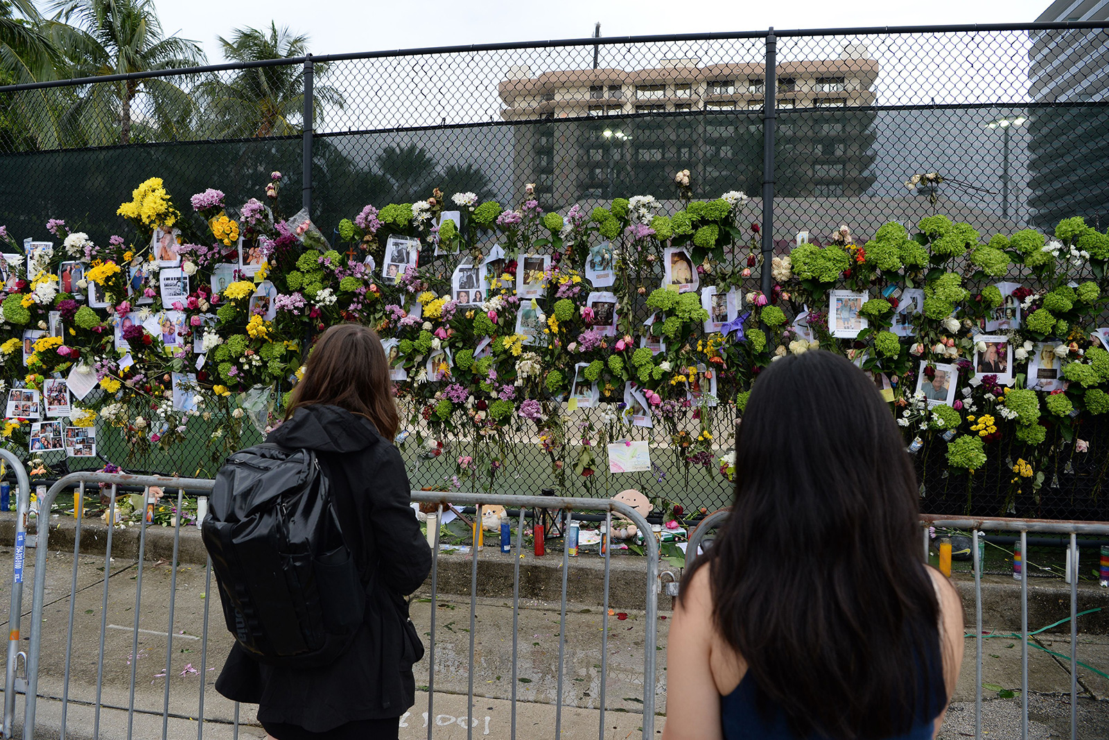 People visit a make shift memorial near the Champlain Towers South in Surfside, Florida, on Monday, June 28. 