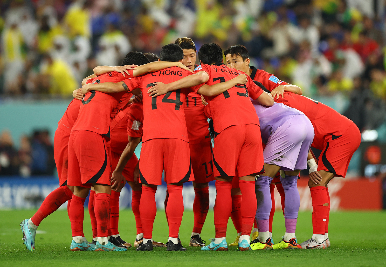 South Korea players gather in a huddle before the start of the second half against Brazil on December 5.