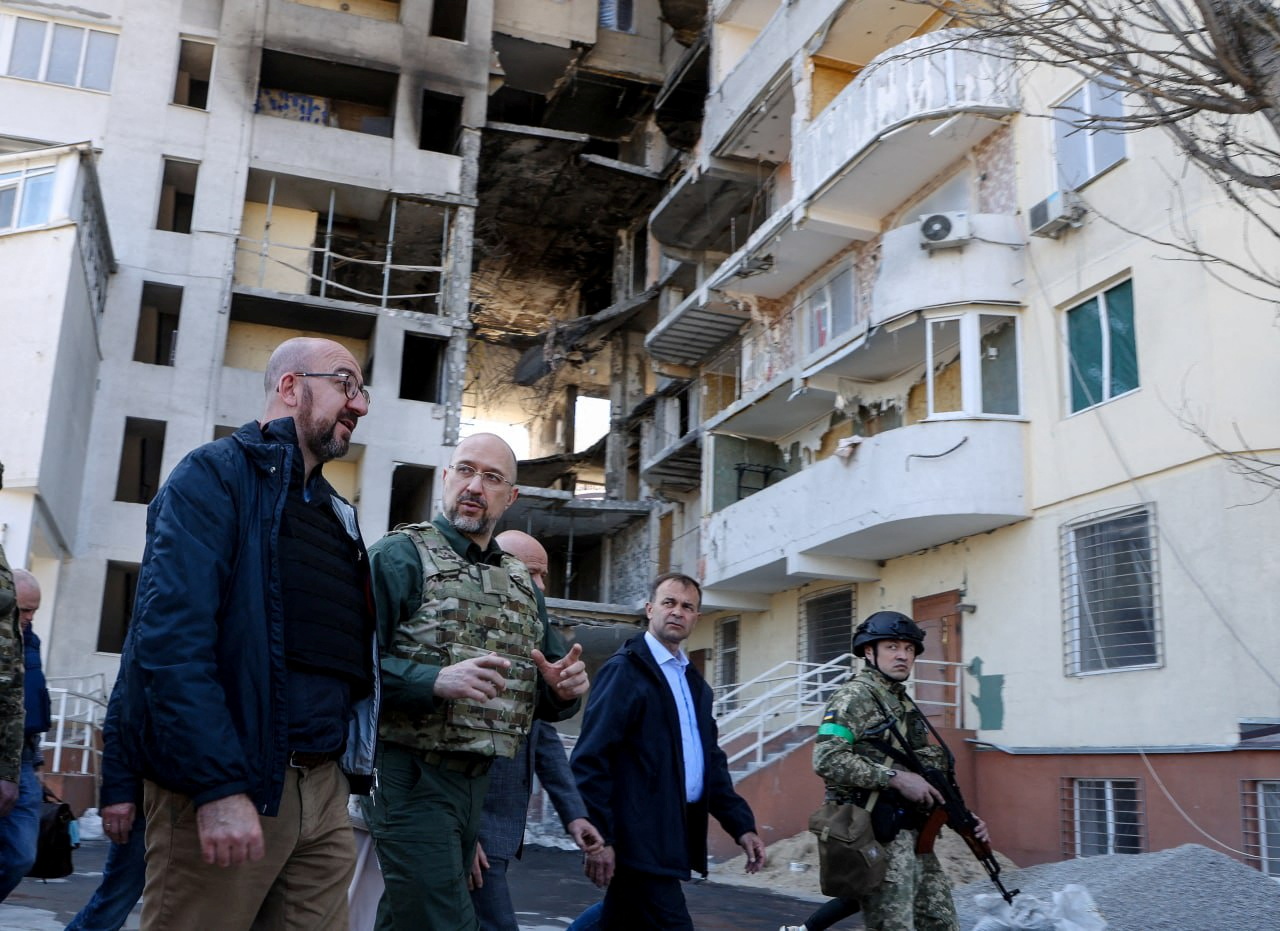European Council President Charles Michel and Ukrainian Prime Minister Denys Shmyhal visit the site where a residential building has been damaged by a Russian missile strike, in Odesa, on Monday.
