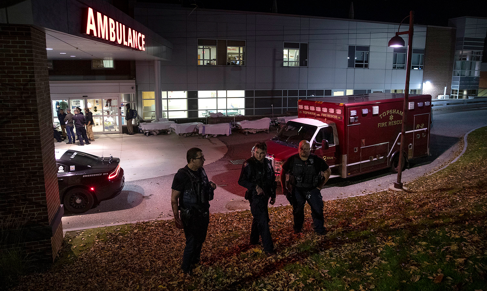 Officers guard the entrance to the emergency room at Central Maine Medical Center in Lewiston, Maine, on October 25.