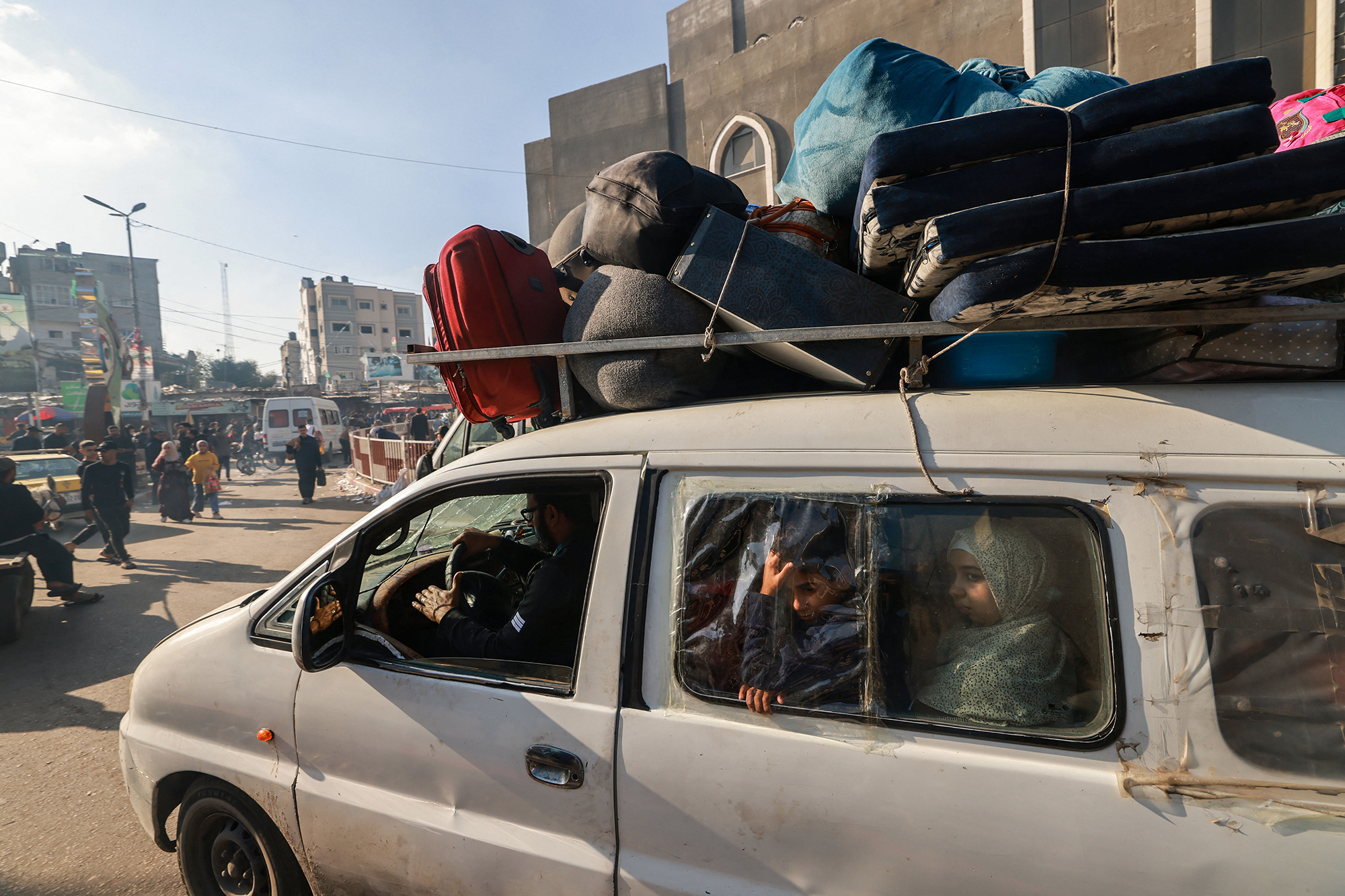 Displaced Palestinians arrive at a camp near Rafah, Gaza, on December 3. 
