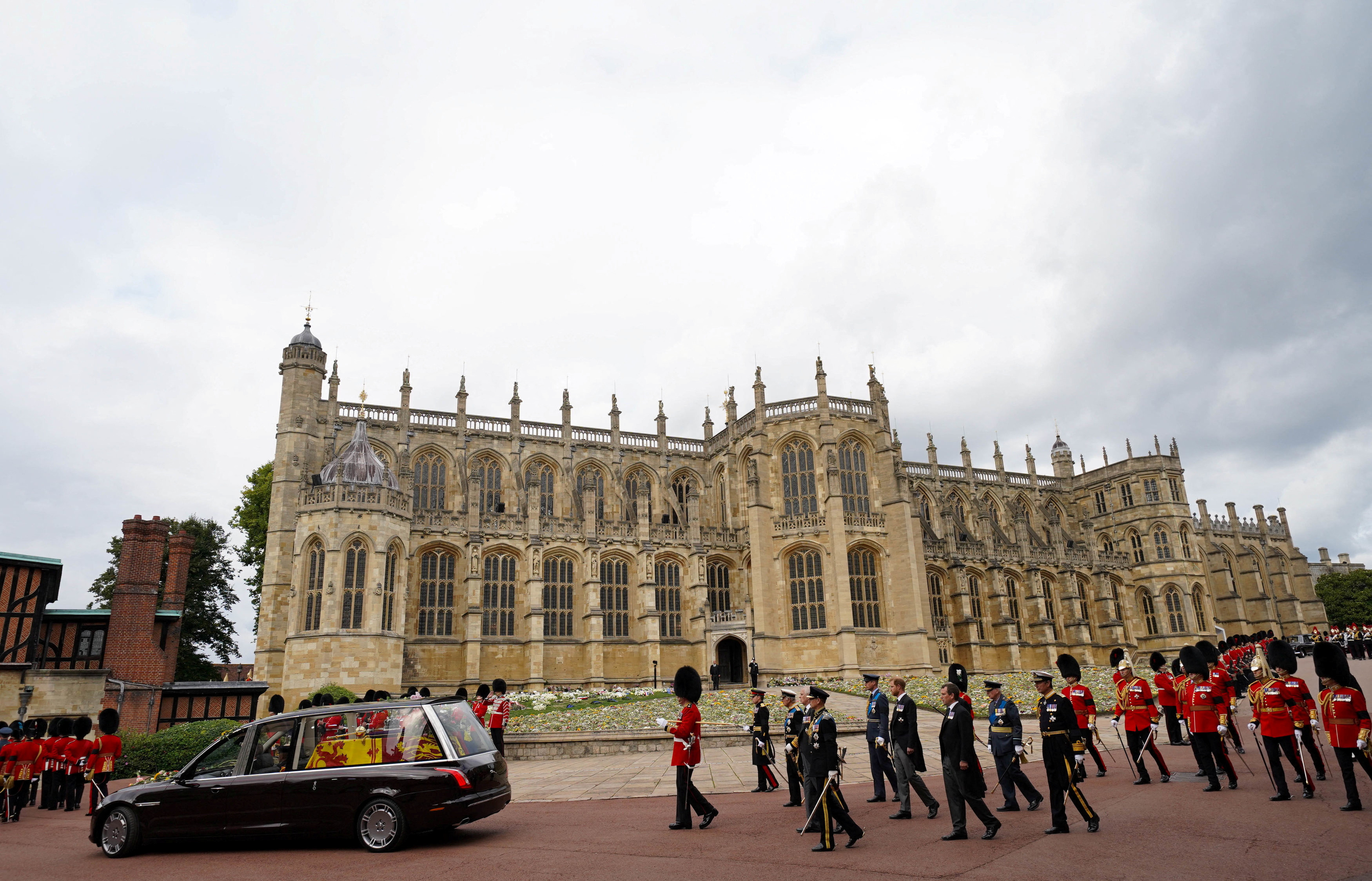 The State Hearse carries the coffin of Queen Elizabeth II through Windsor Castle to a Committal Service at St George's Chapel.