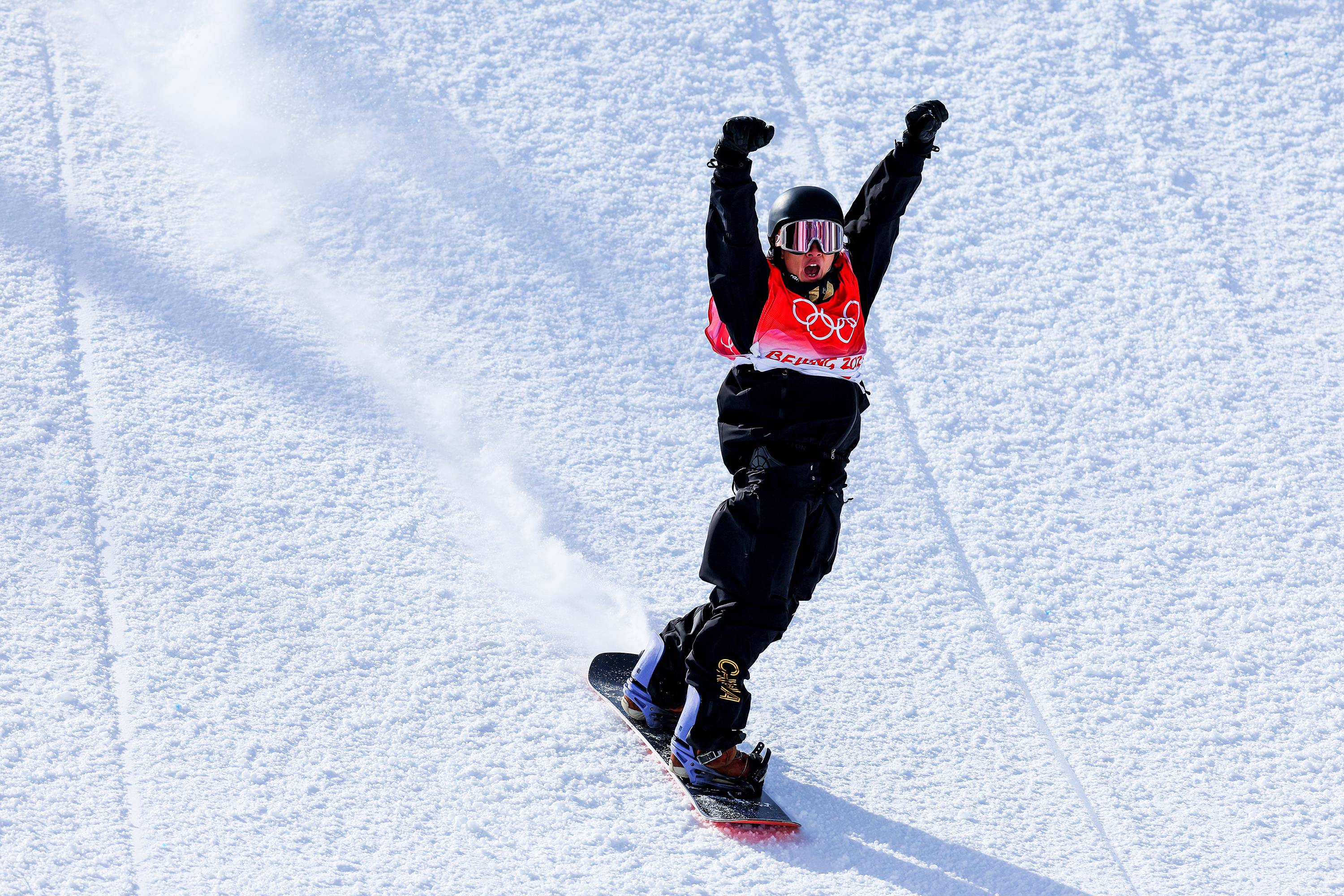 China's Su Yiming celebrates during the men's snowboard slopestyle final on Feb. 7.