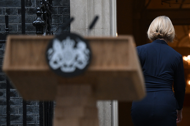 Britain's Prime Minister Liz Truss comes back inside 10 Downing Street, in central London, on October 20 following a statement to announce her resignation. 