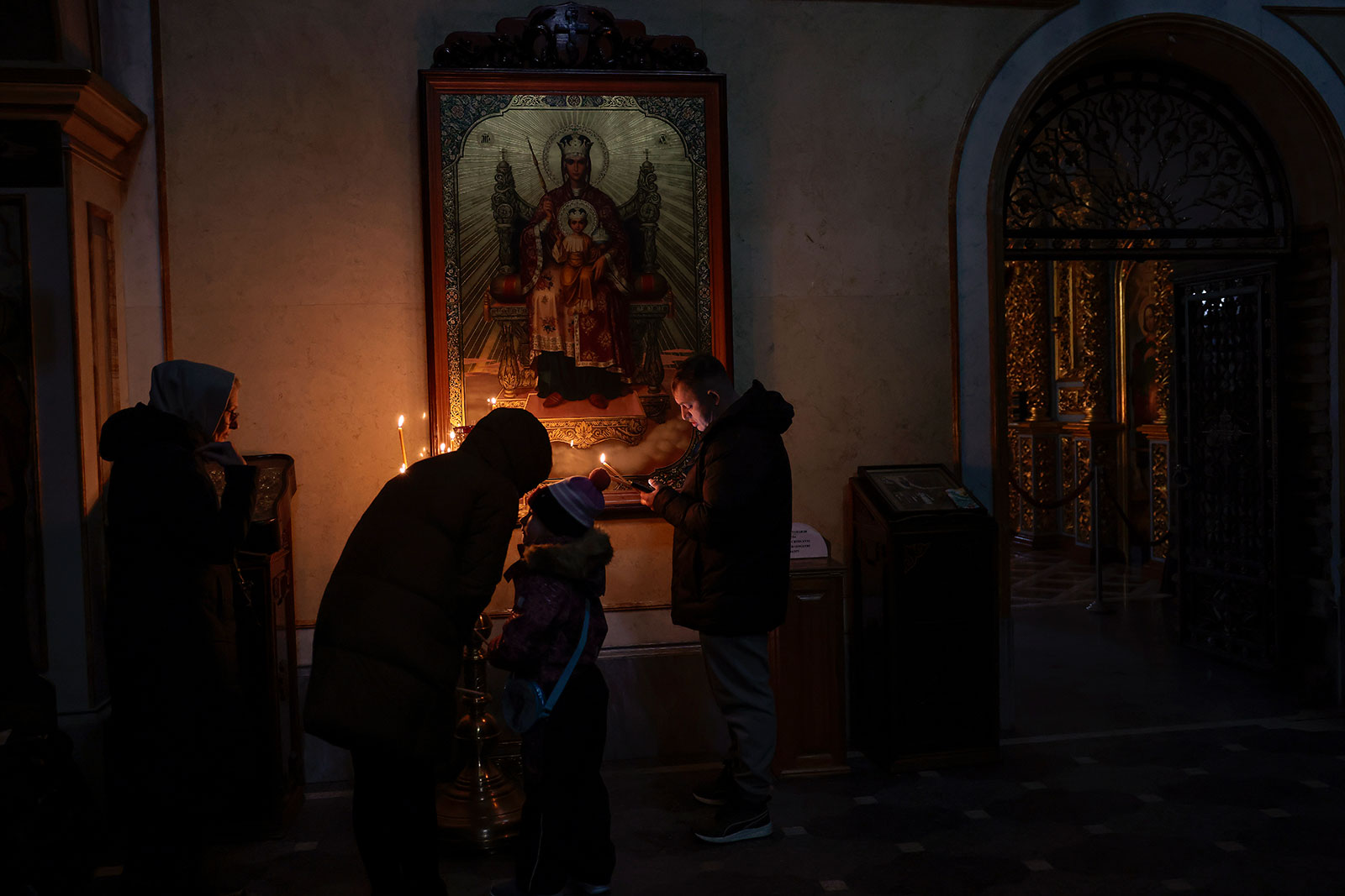 Members of the public pray at Kyiv Pechersk Lavra in Kyiv on December 4. 