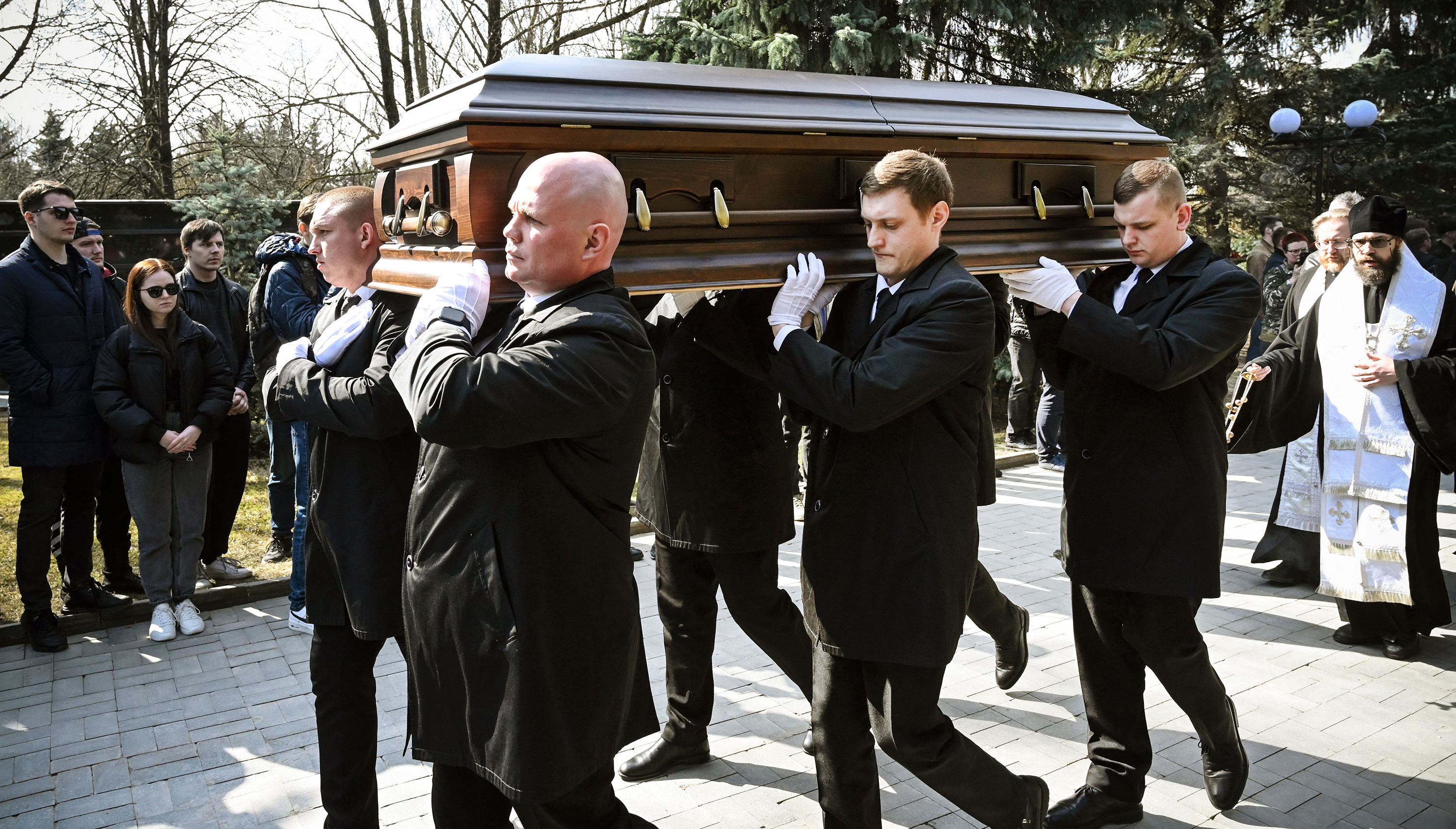 Pallbearers carry the coffin of Russian military blogger Maxim Fomin during his funeral in Moscow, on April 8. 