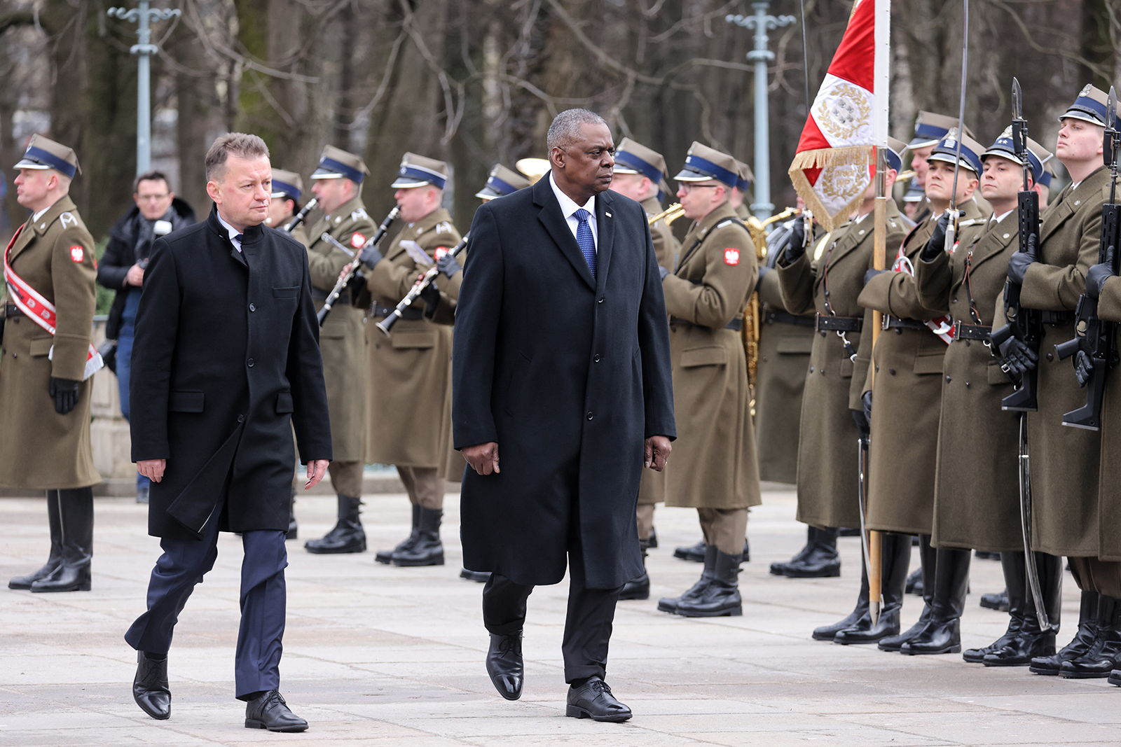 US Defense Secretary Lloyd Austin, right, inspects the honor guard with his Polish counterpart Mariusz Blaszczak during a welcoming ceremony in Warsaw, Poland, on February 18. 