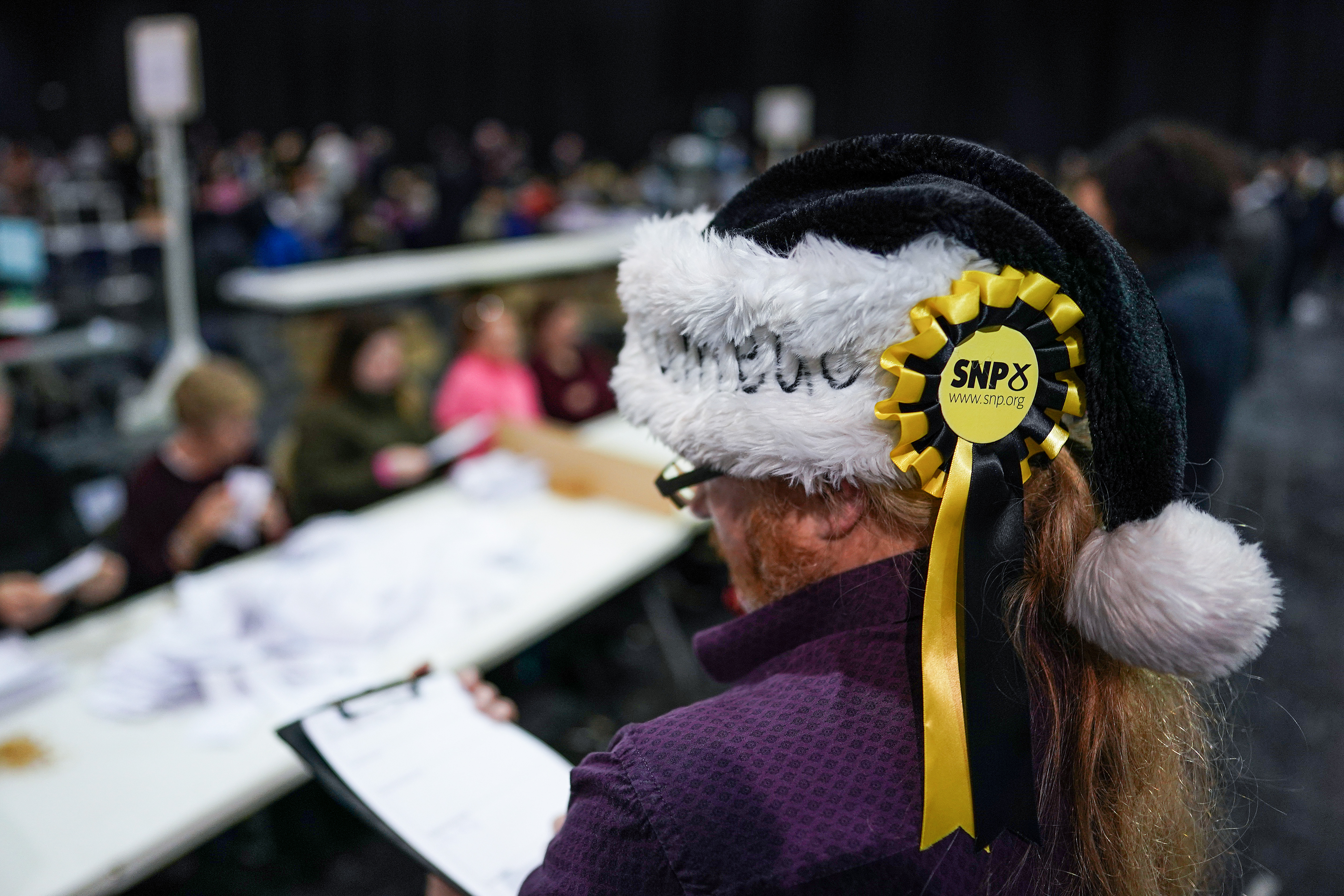 A party official observes as staff count ballotsin Glasgow. Photo: Jeff J Mitchell/Getty Images