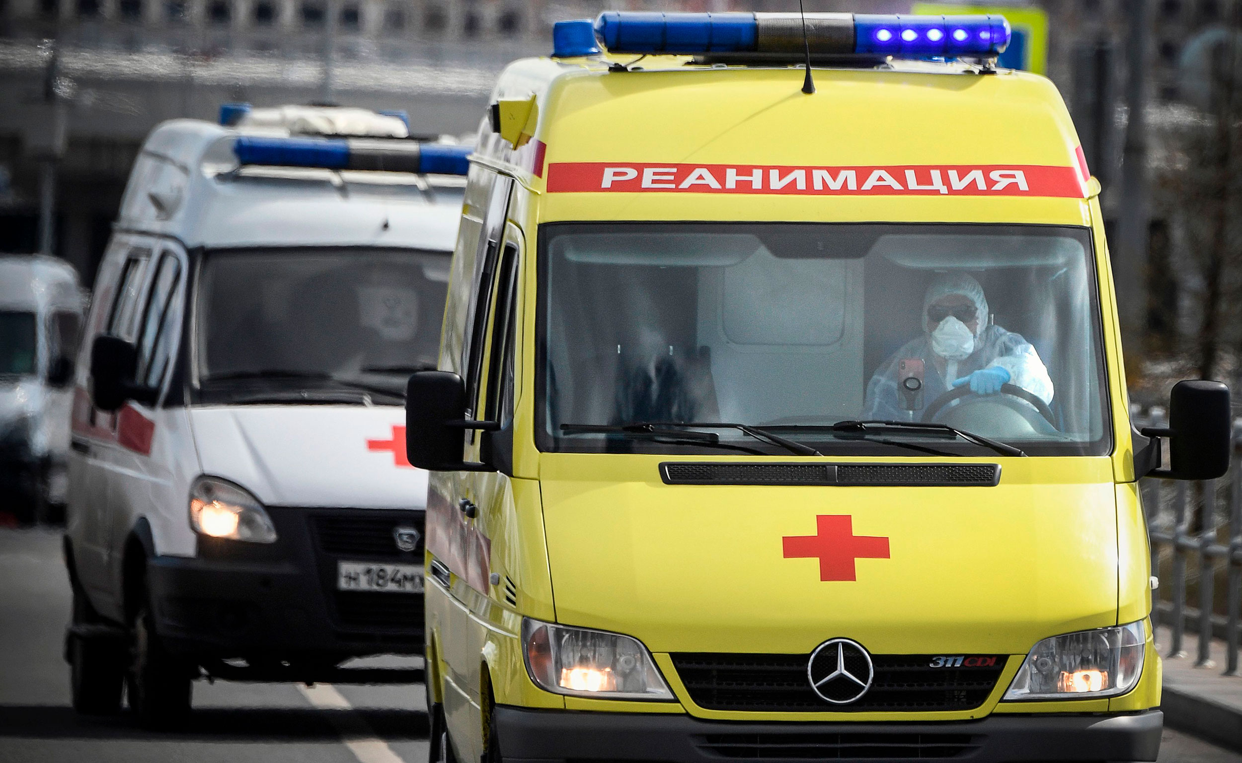 Ambulances arrive to a hospital where patients infected with the COVID-19 novel coronavirus are being treated in the settlement of Kommunarka outside Moscow on April 28. 