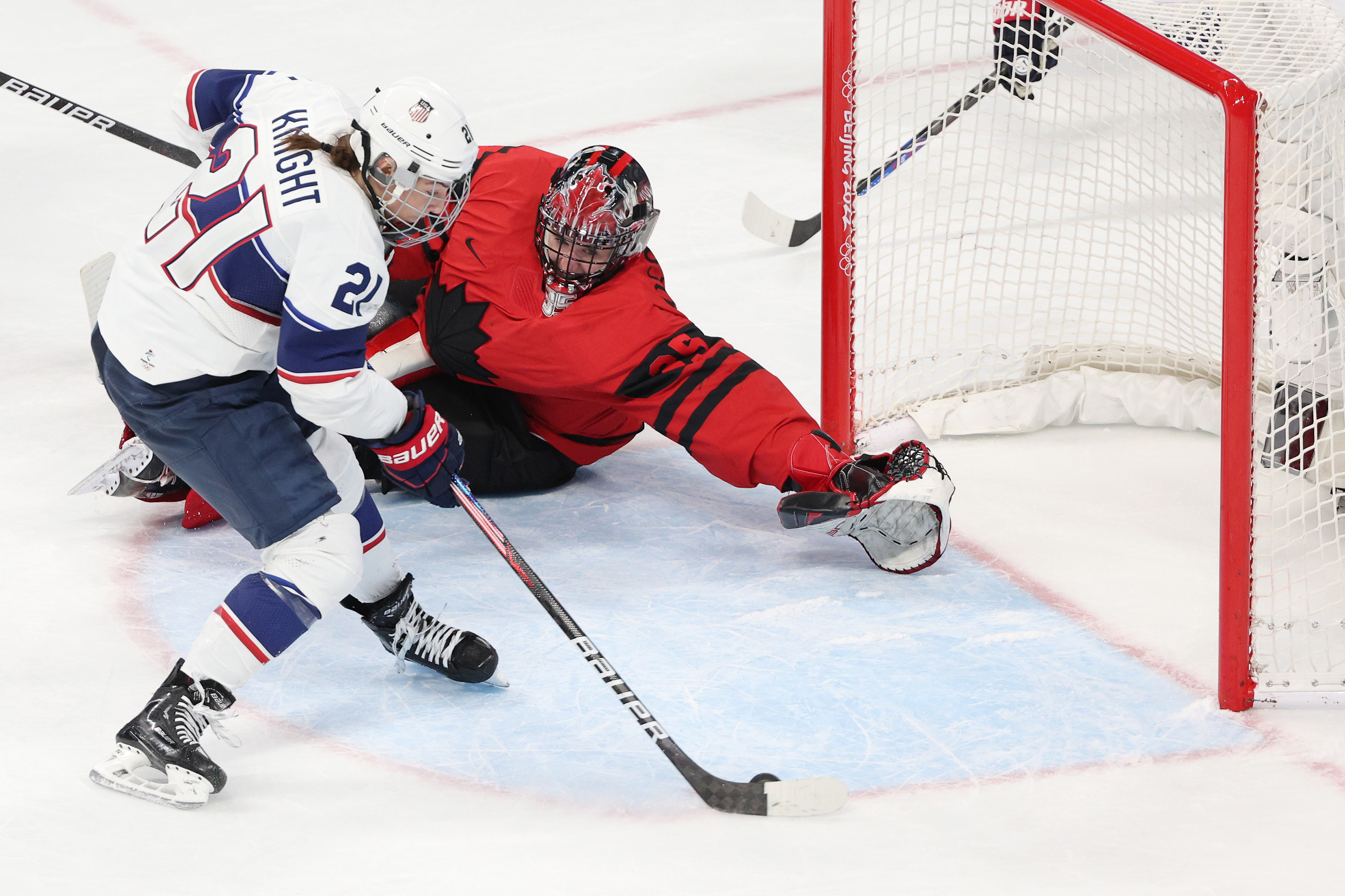 Team USA's Hilary Knight #21 scores against Team Canada's Ann-Renee Desbiens #35 in the second period during the women's ice hockey gold medal match on Thursday.