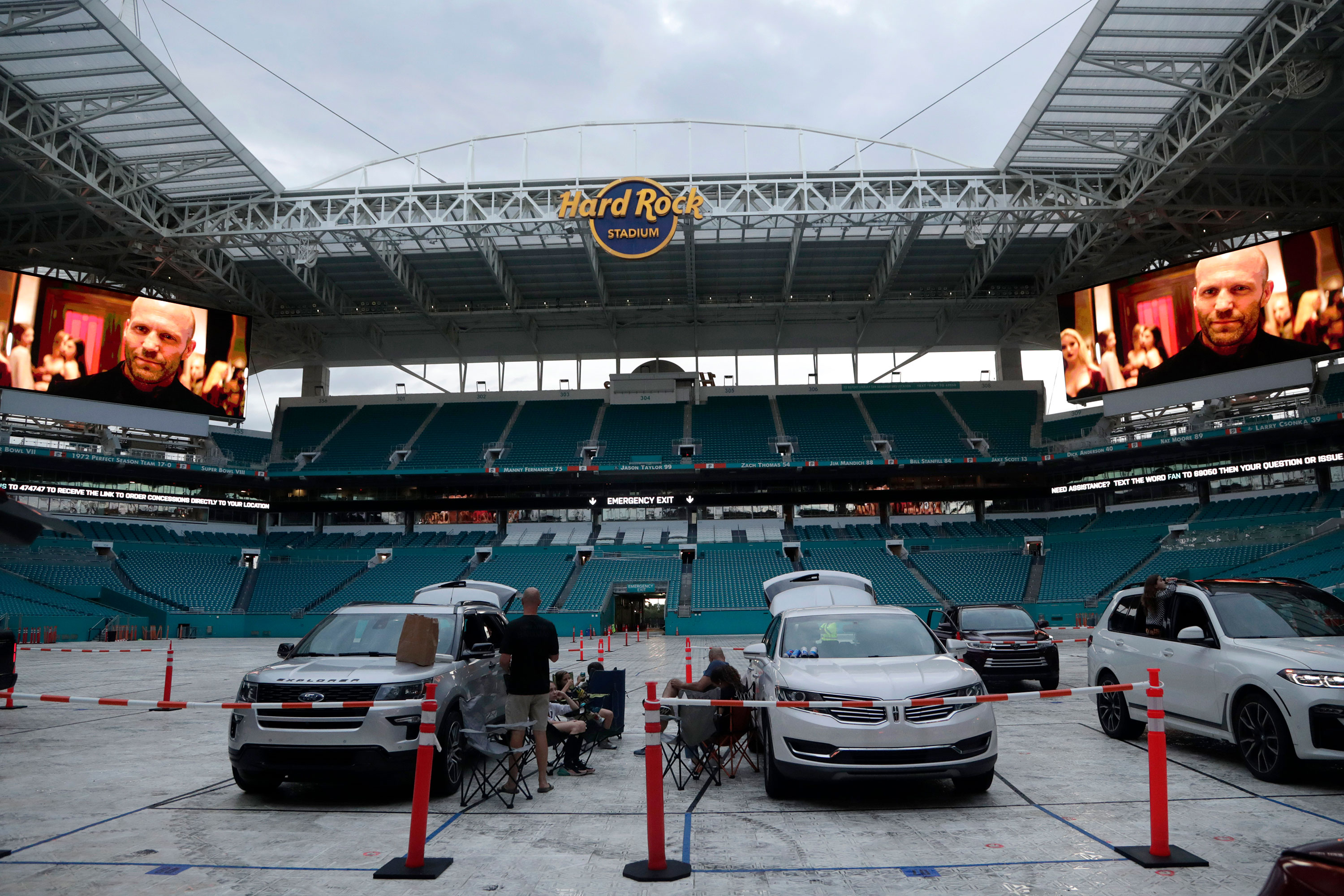 People sit outside of their vehicles to watch a movie at Hard Rock Stadium in Miami Gardens, Florida, on June 18.