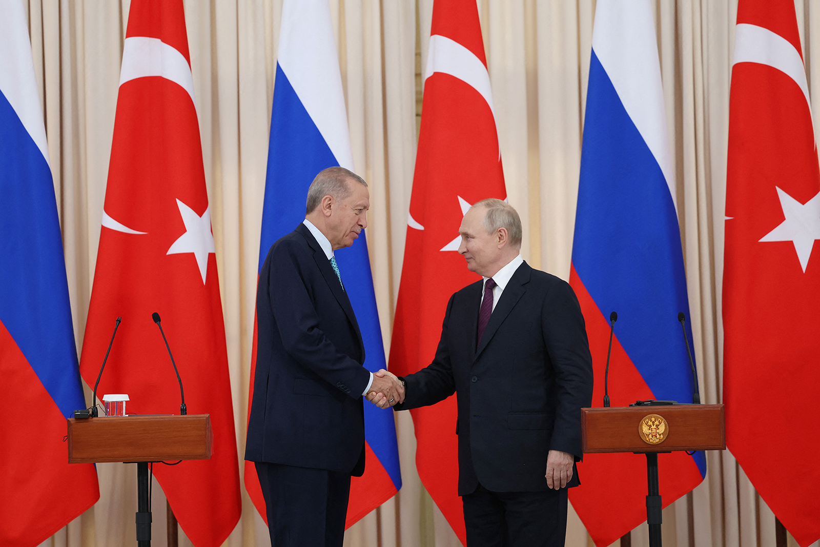 Recep Tayyip Erdogan shakes hands with his Russian counterpart Vladimir Putin during a press conference in Sochi, Russia on September 4.