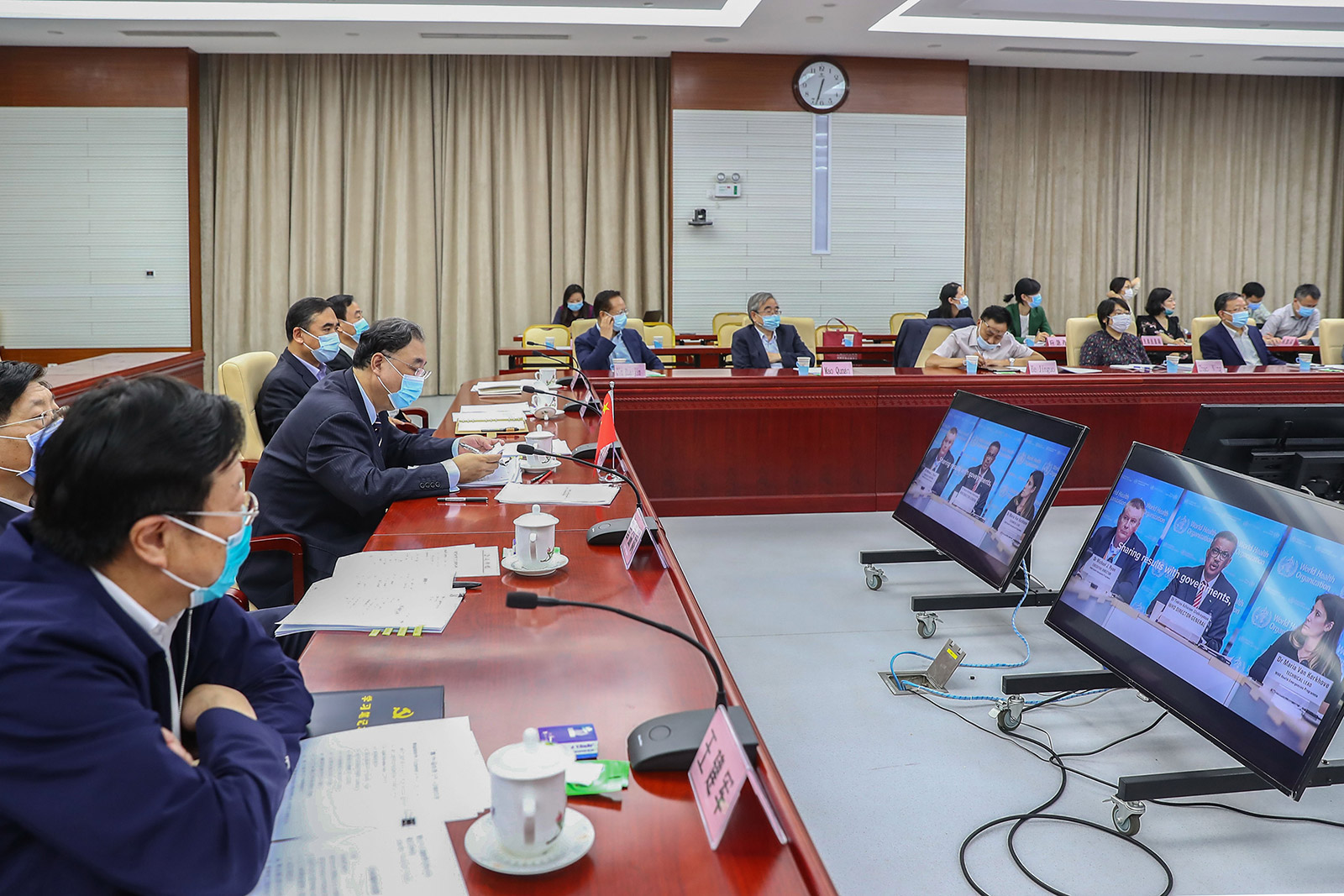 Delegates attend the 73rd World Health Assembly via video conference in Beijing on Monday.