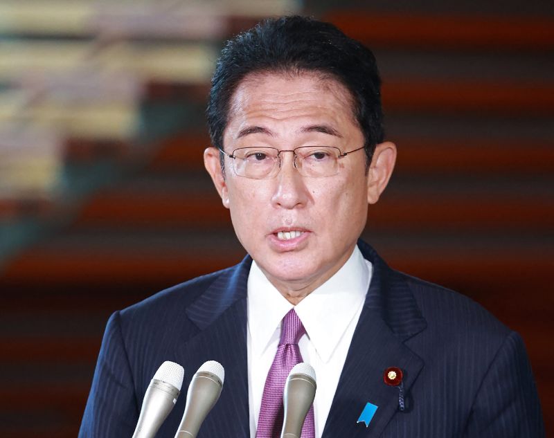 Japanese Prime Minister Fumio Kishida speaks to reporters in Tokyo on September 9 about the death of Britain's Queen Elizabeth II. 