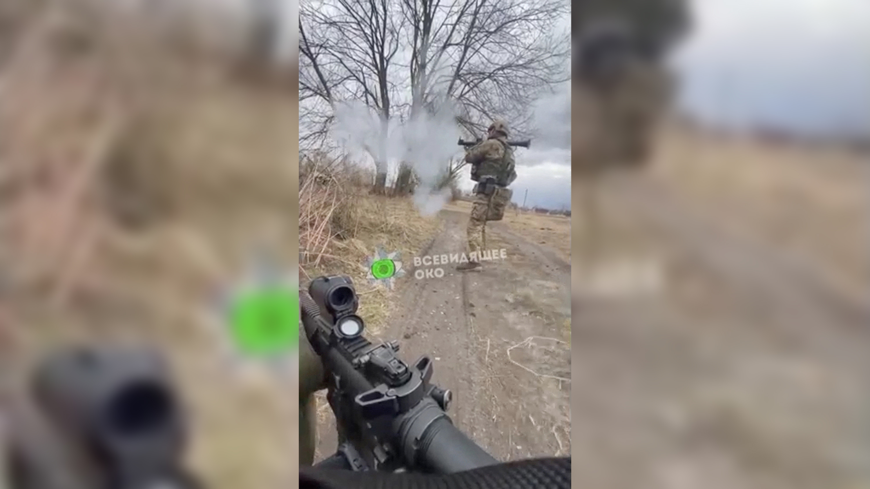 A frame from a verified video showing Ukrainian National Police special forces launch an RPG against a Russian tank. 