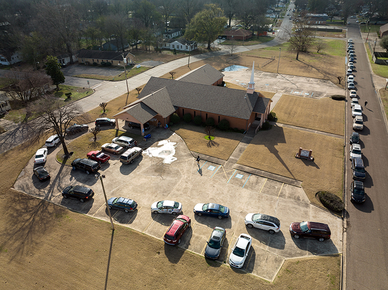 Vehicles wait in line during a mobile Covid-19 clinic at Saint Paul MB Church in Cleveland, Mississippi, on Saturday, January 8.