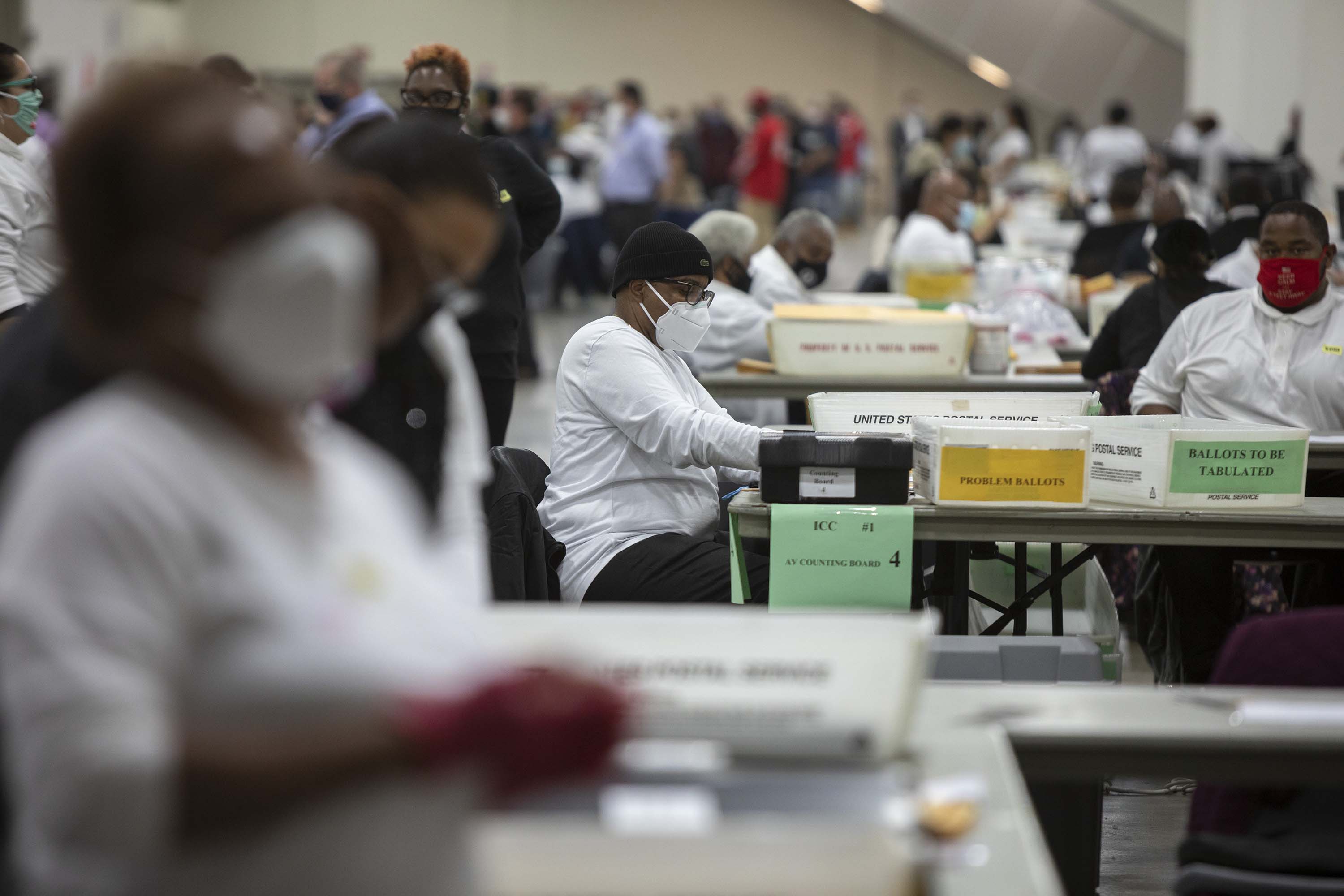 Workers with the Detroit Department of Elections process ballots at the Central Counting Board in Detroit, Michigan on November 4.