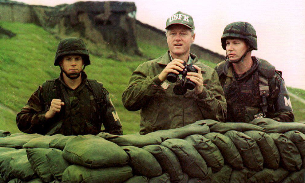 US President Bill Clinton uses binoculars to look across the demilitarized zone (DMZ) into North Korea on July 11, 1993.