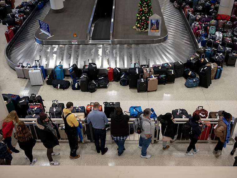 Stranded travelers search for their luggage at the Southwest Airlines Baggage Claim at Midway Airport on December 27, 2022 in Chicago, Illinois. 