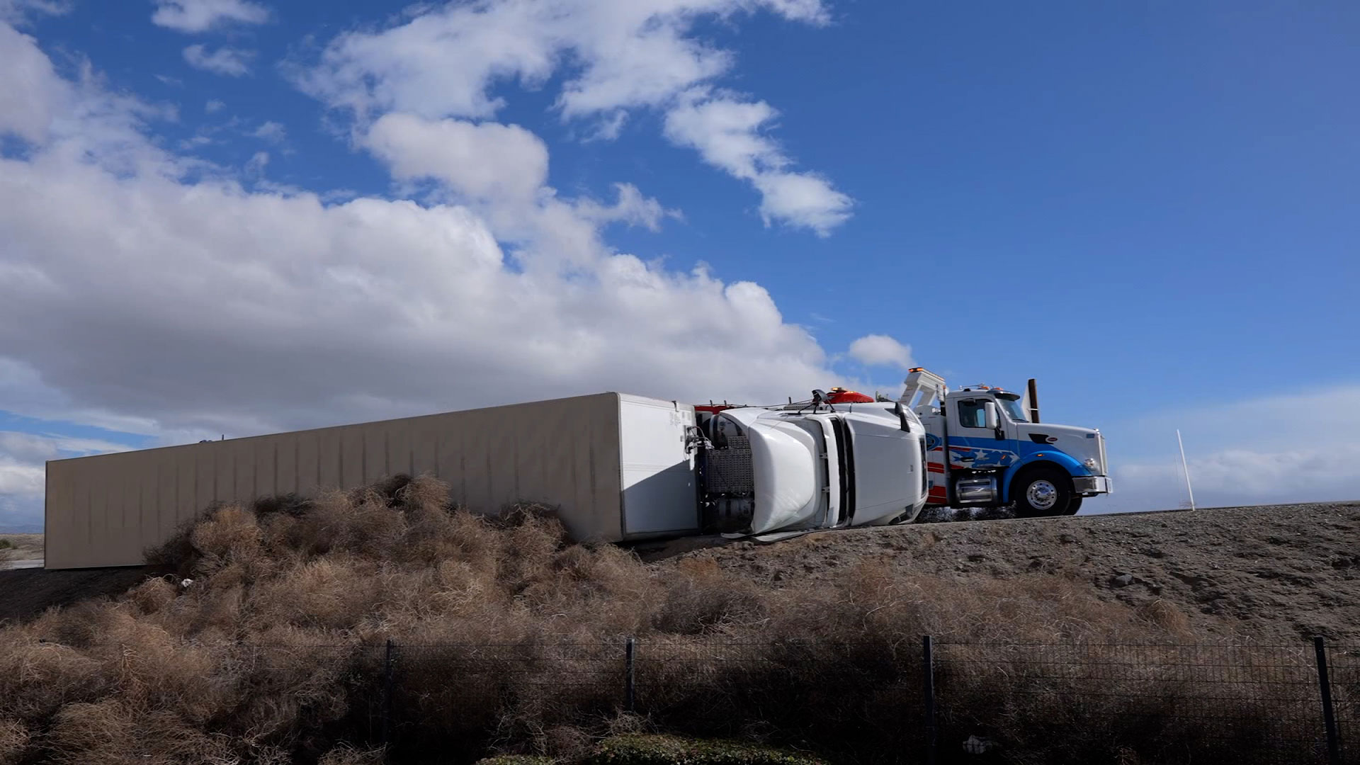 A still from a video shows a semi-truck that was blown over in Grapevine, California, on Sunday.
