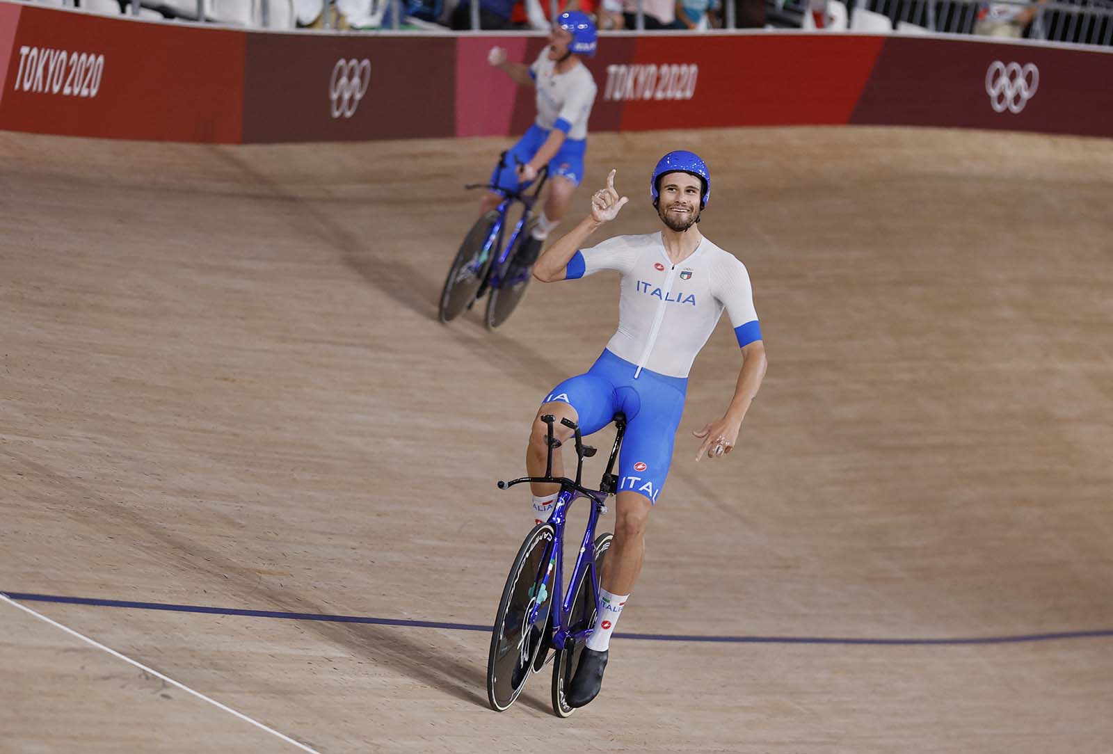 Italy's Filippo Ganna celebrates after winning gold and setting a new world record in the men's track cycling team pursuit finals on August 4. 
