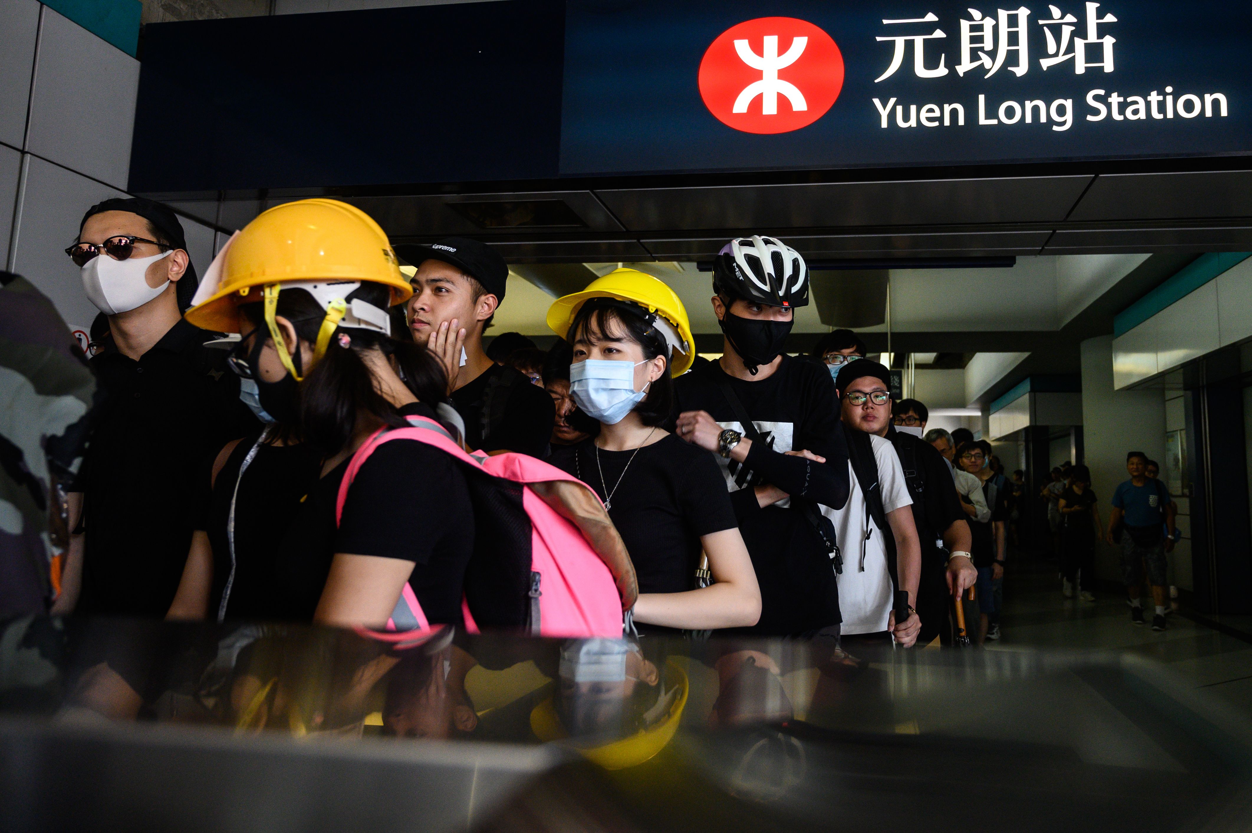Protesters line up inside an MTR station in the Yuen Long district of Hong Kong on July 27.