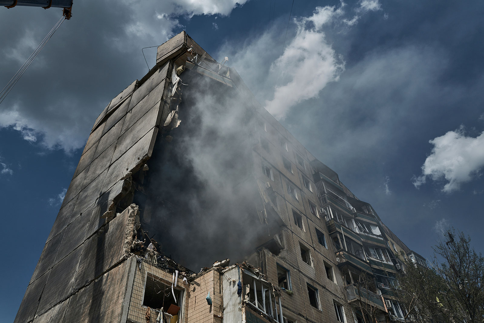 Emergency services work at an apartment building after a missile strike in Kryvyi Rih, Ukraine, on Monday, July 31. 